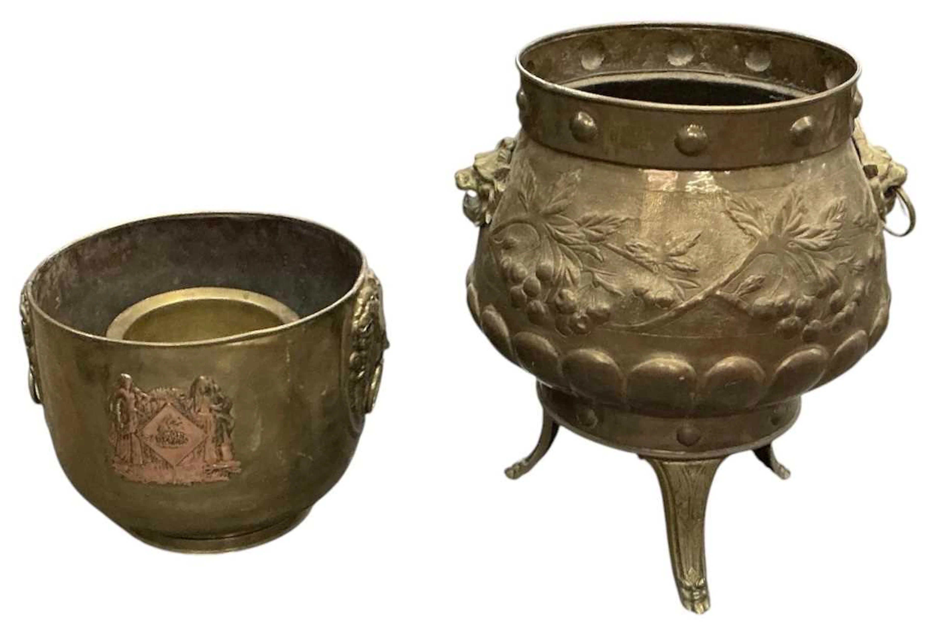 A large late 19th/early 20th century twin handled brass cauldron