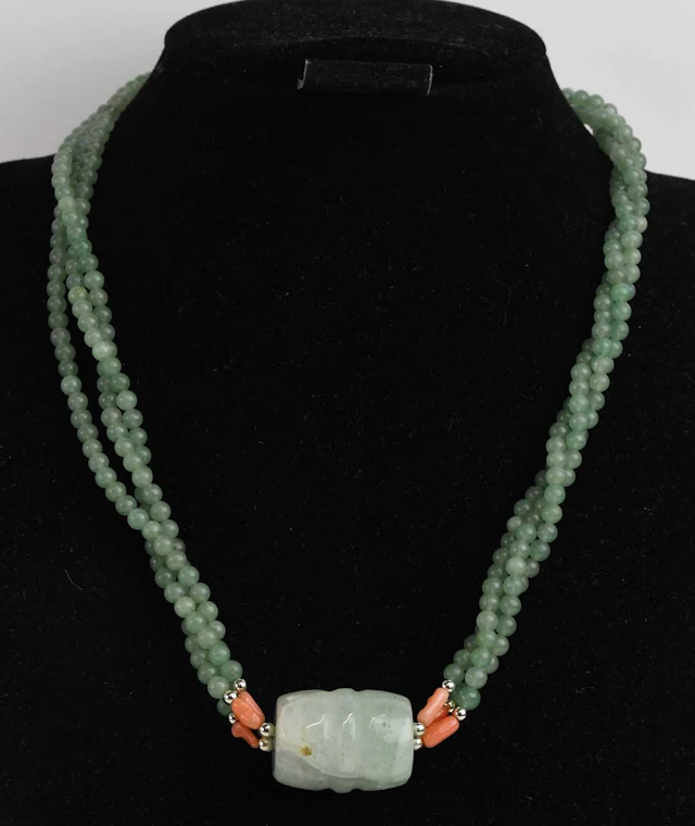 A twisted three strand apple green jade necklace