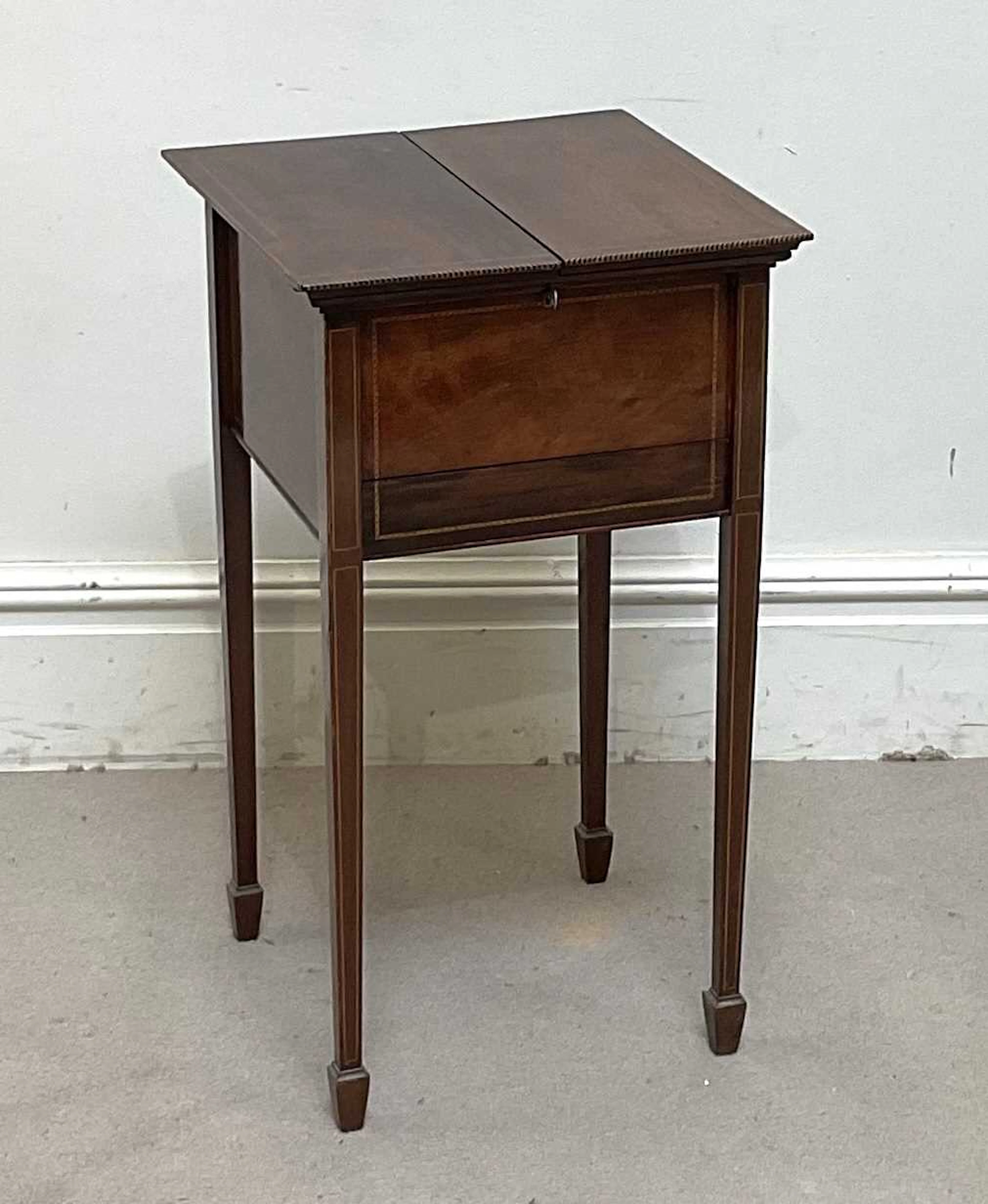 An Edwardian inlaid mahogany sewing cabinet