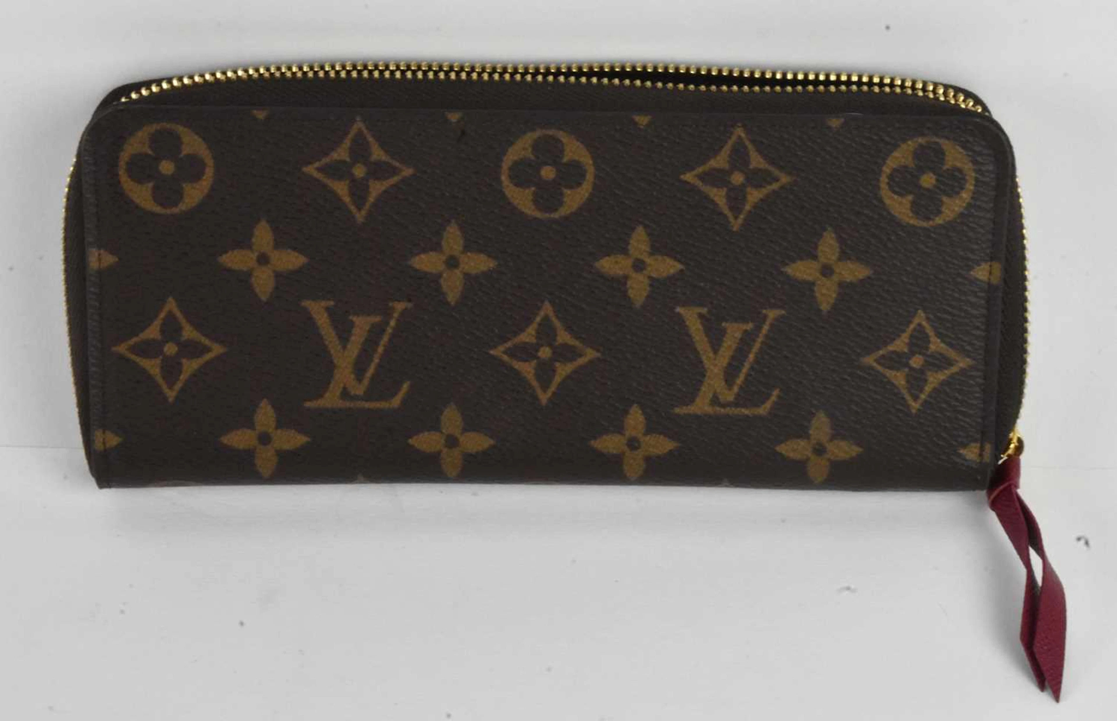 LOUIS VUITTON; a lady's brown monogram leather rectangular purse