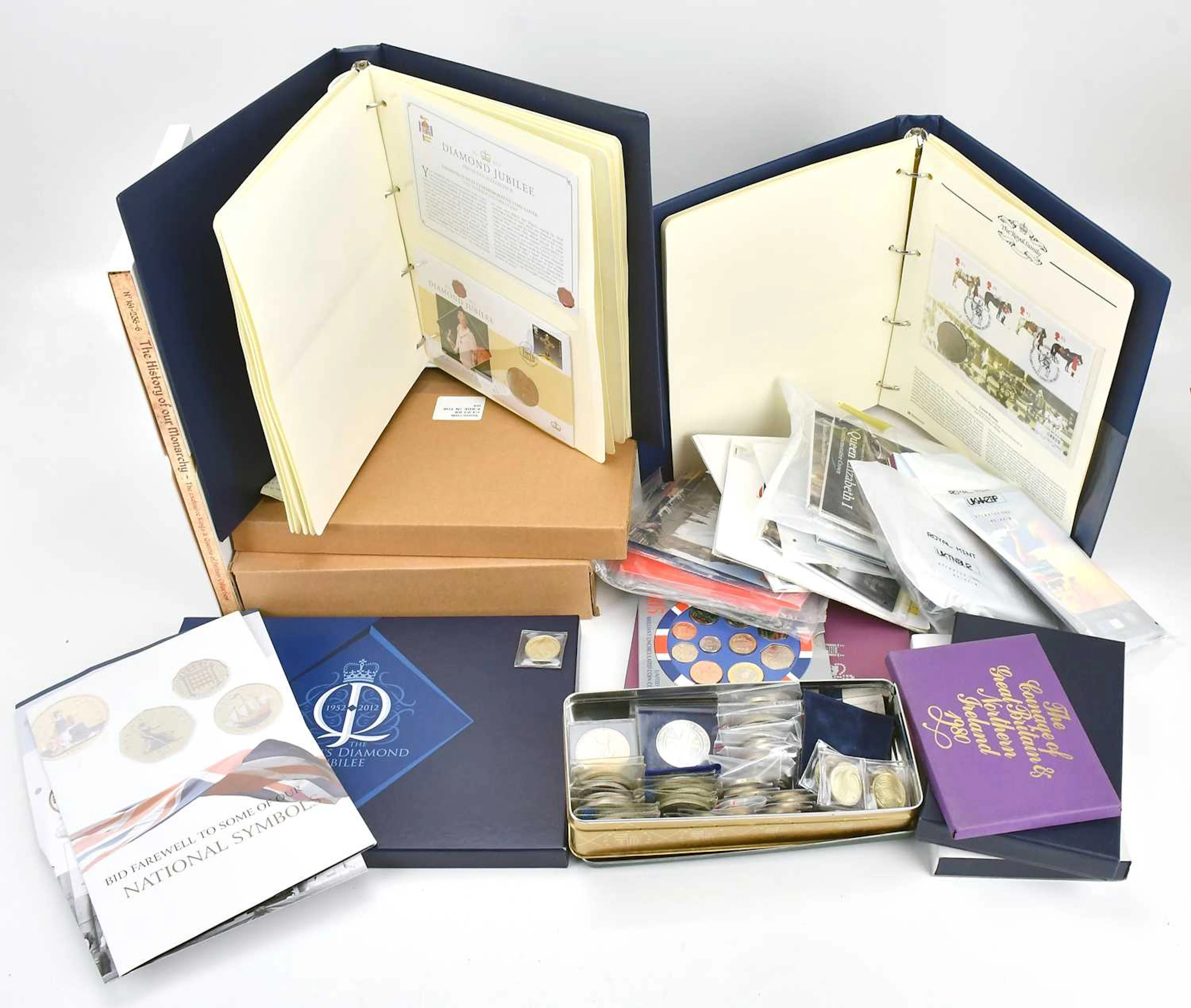 A collection of commemorative coins and packs