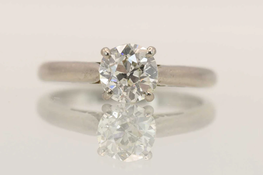 A white metal diamond solitaire ring