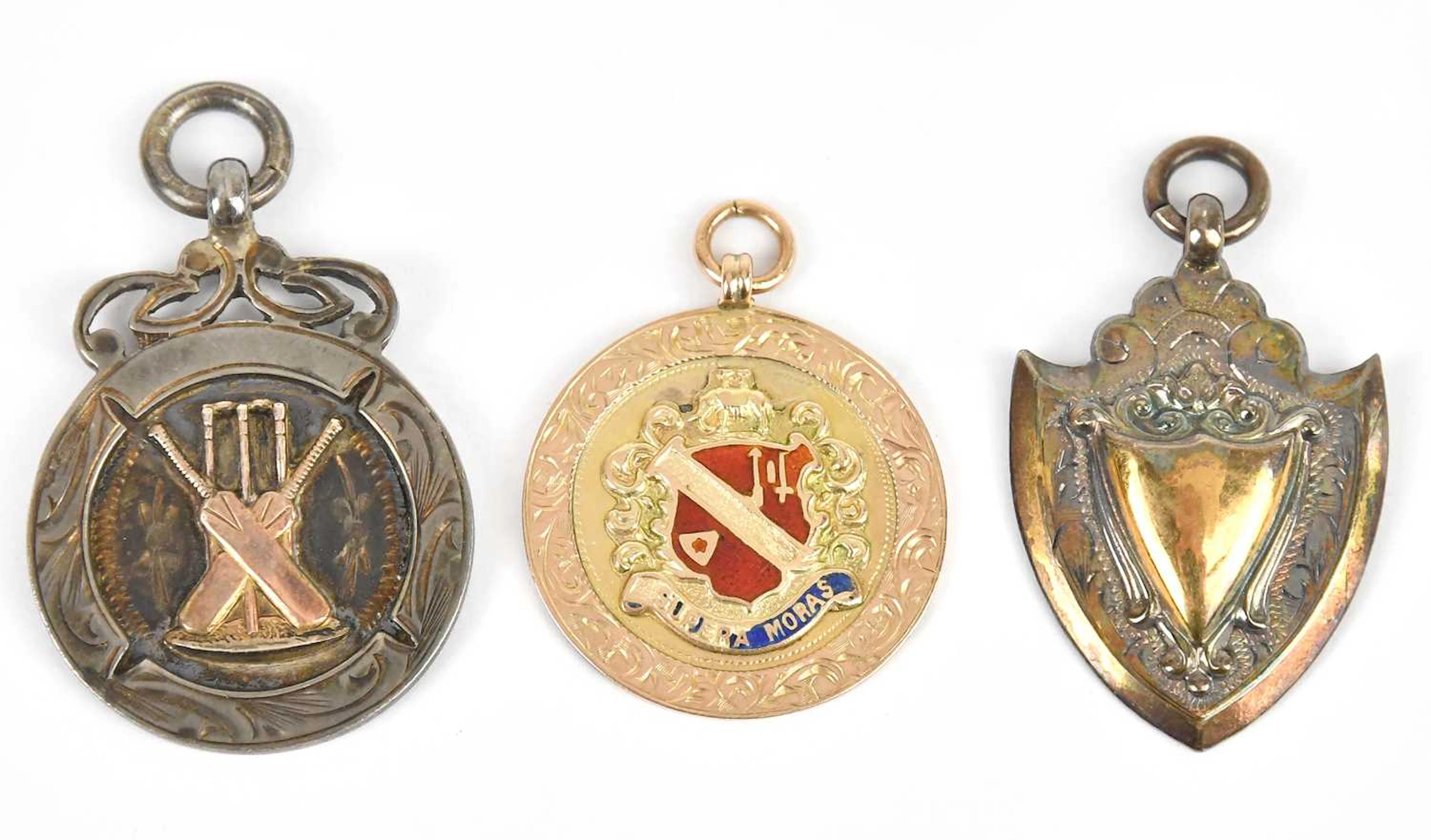 A yellow metal and enamel sporting medal
