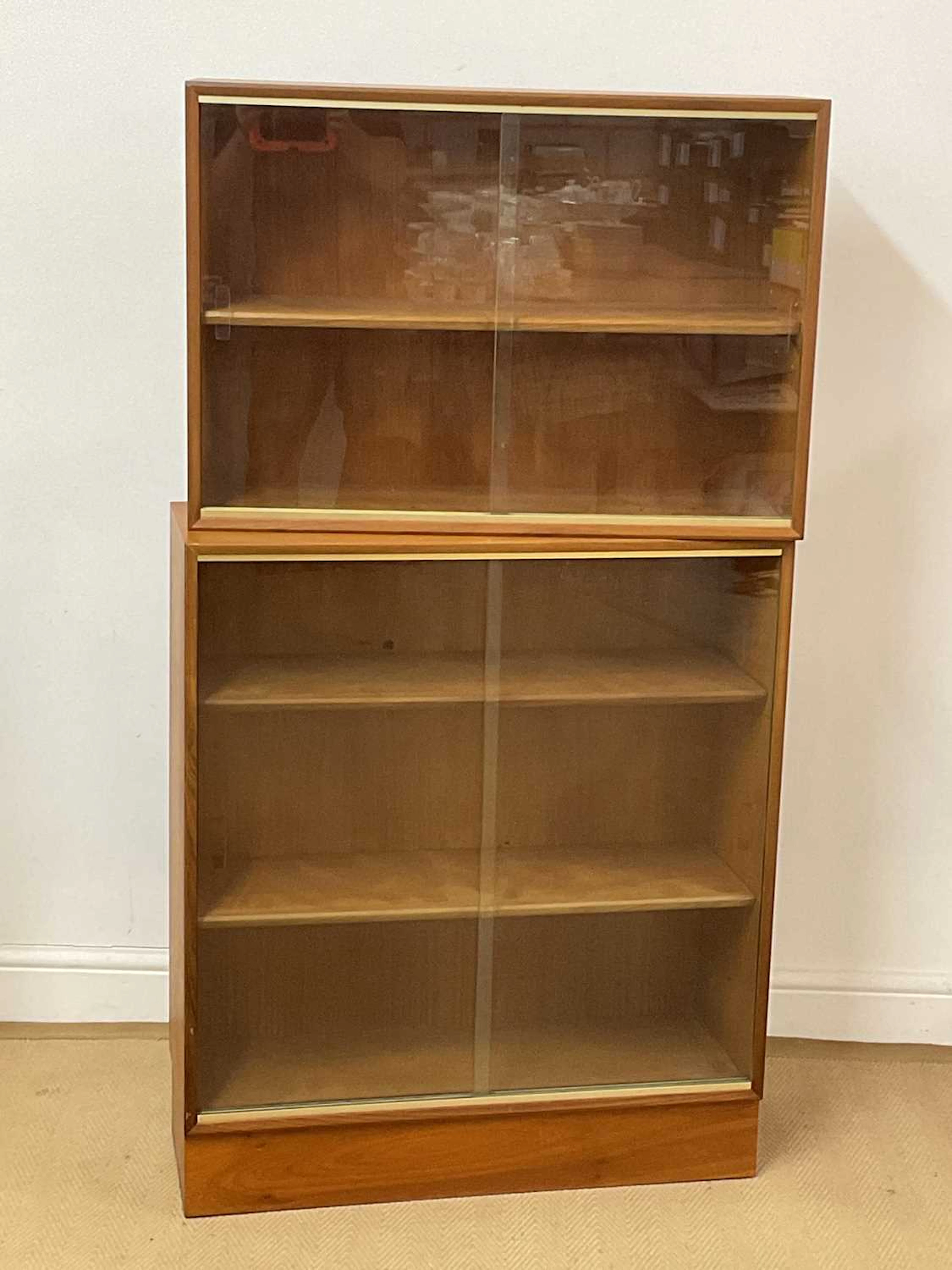 MINTY OF OXFORD; two mid 20th century teak glazed bookcases