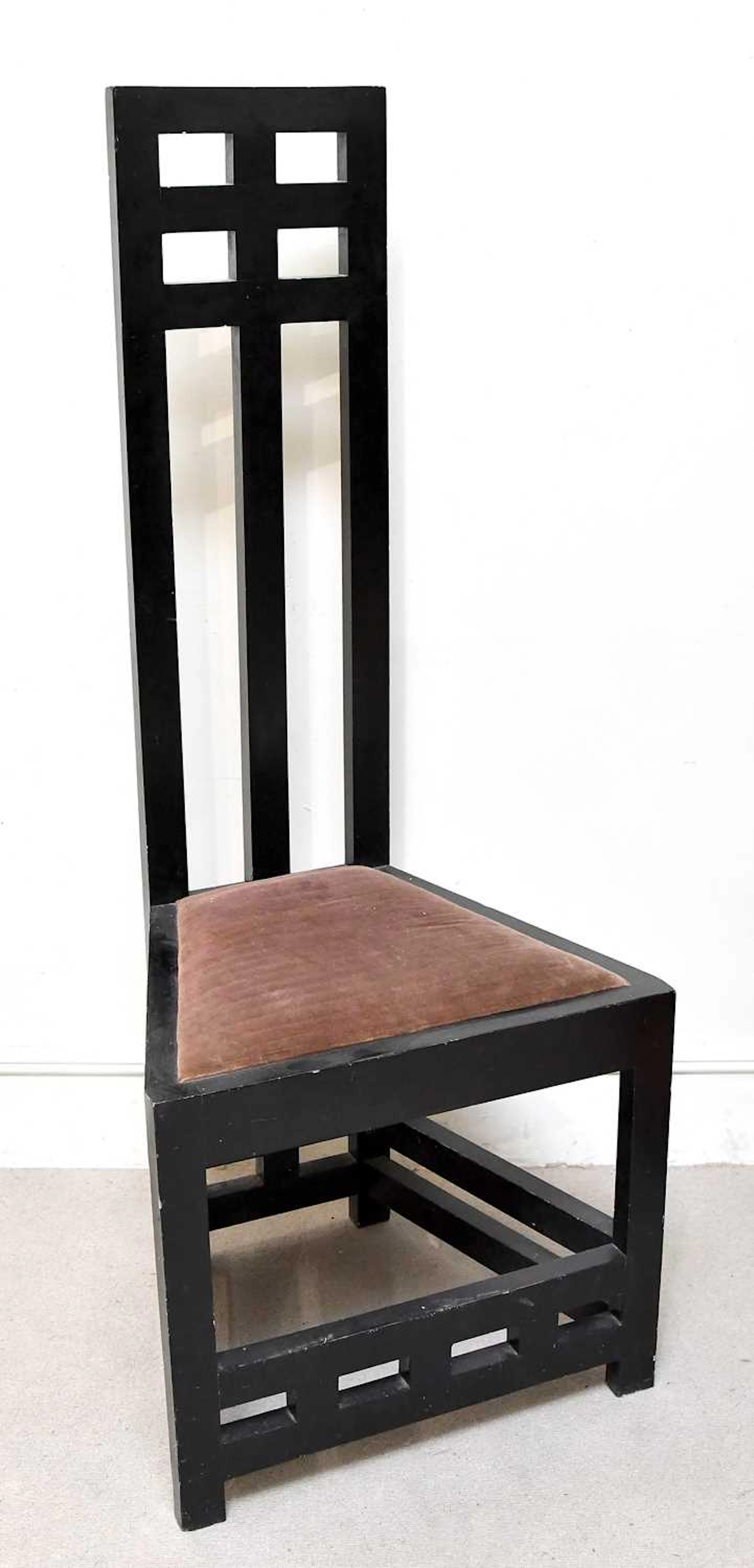 An Arts & Crafts ebonised chair