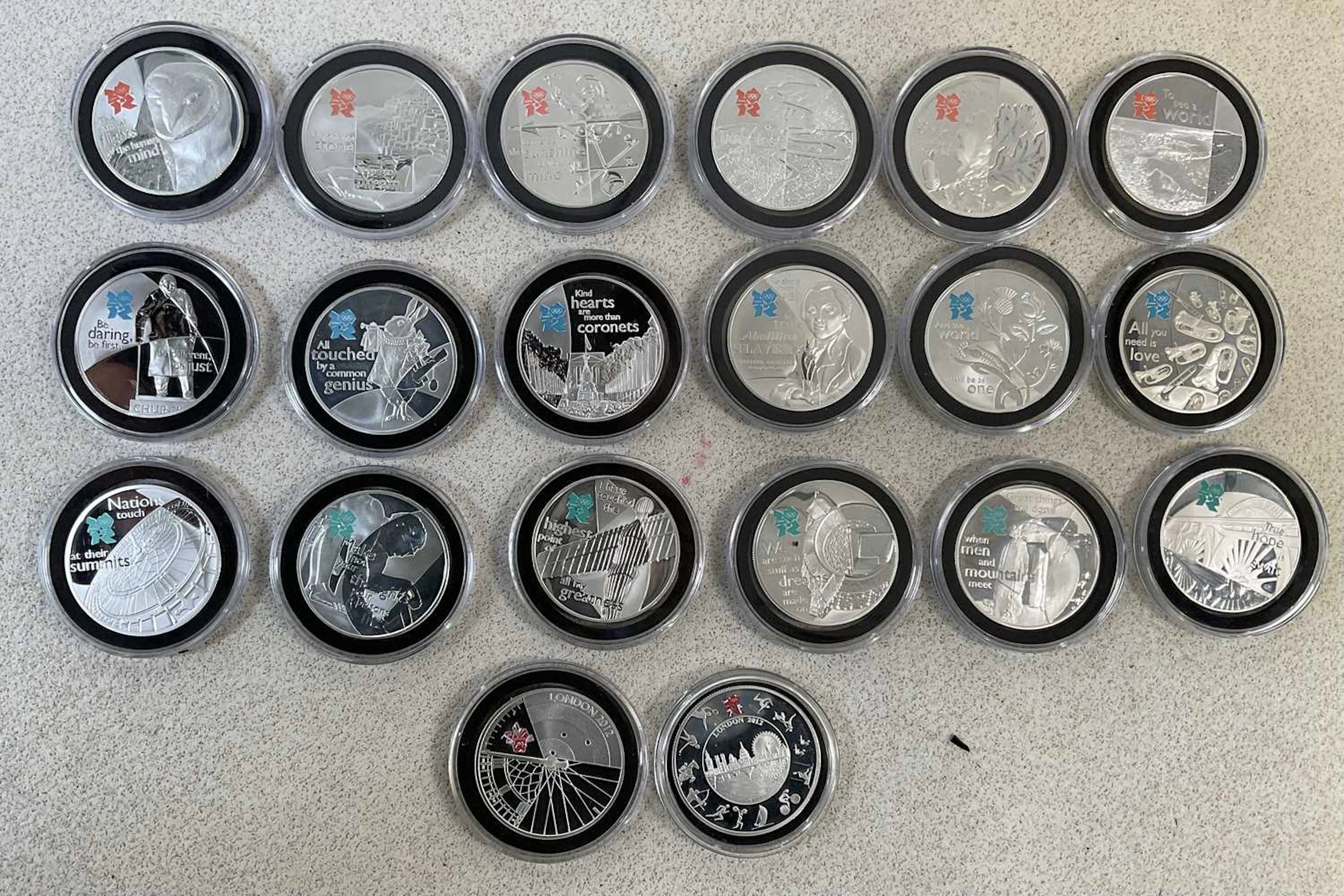 ROYAL MINT; a collection of fourteen silver £5 coins comprising six dated 2009
