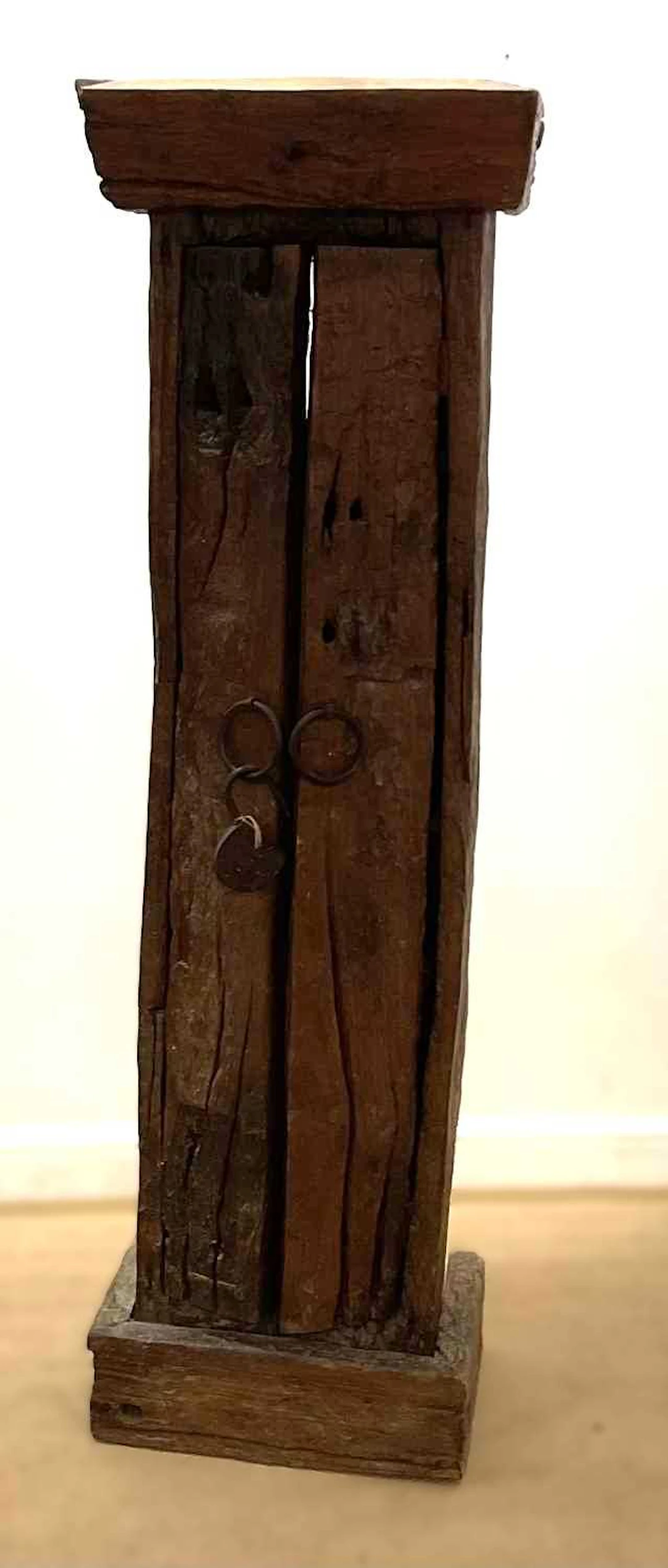 An Indonesian hardwood twin door cabinet having five fitted shelves