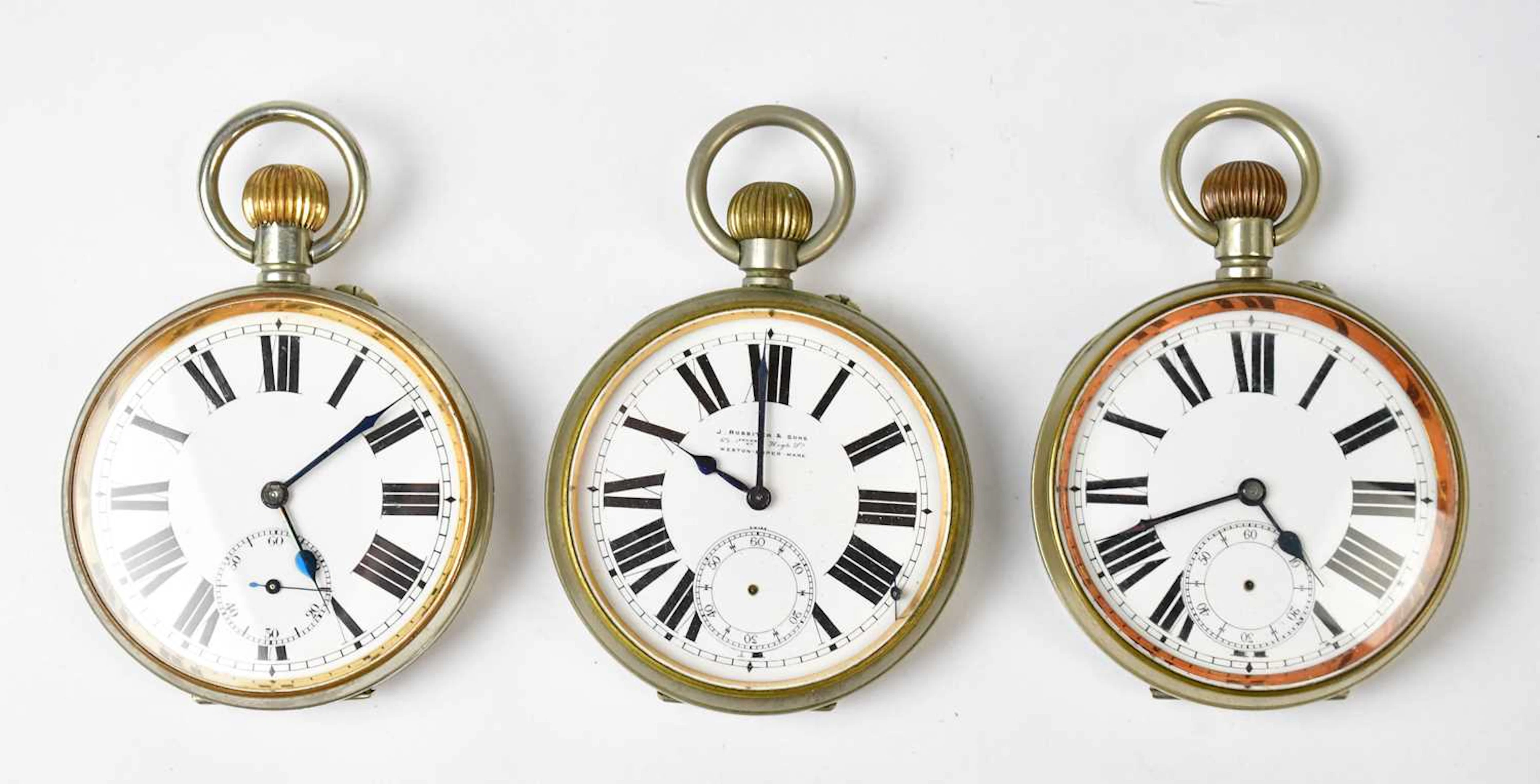 Three oversized silver-plated open face crown wind pocket watches
