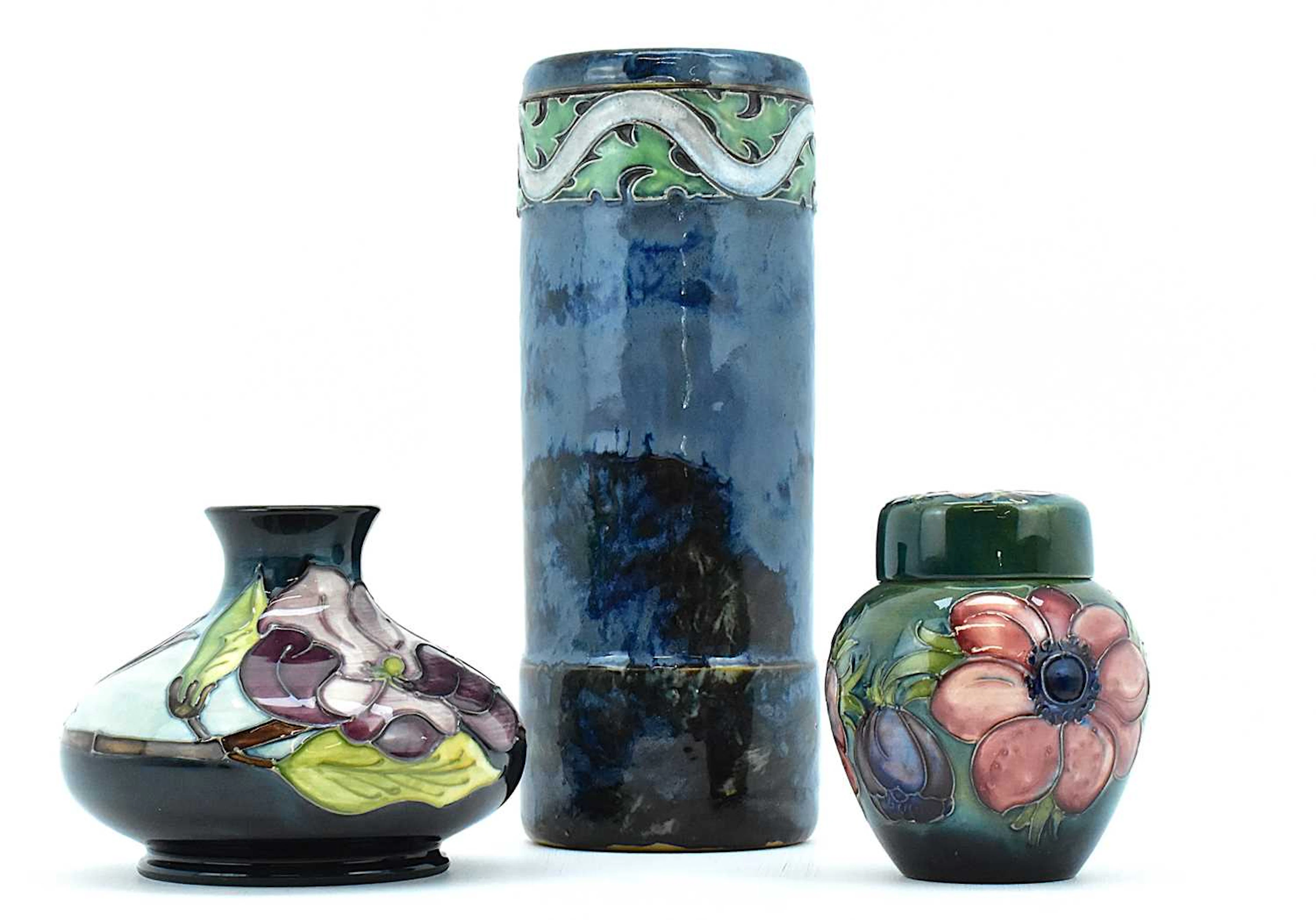 MOORCROFT; a lidded ginger jar in 'Anemone' on green ground