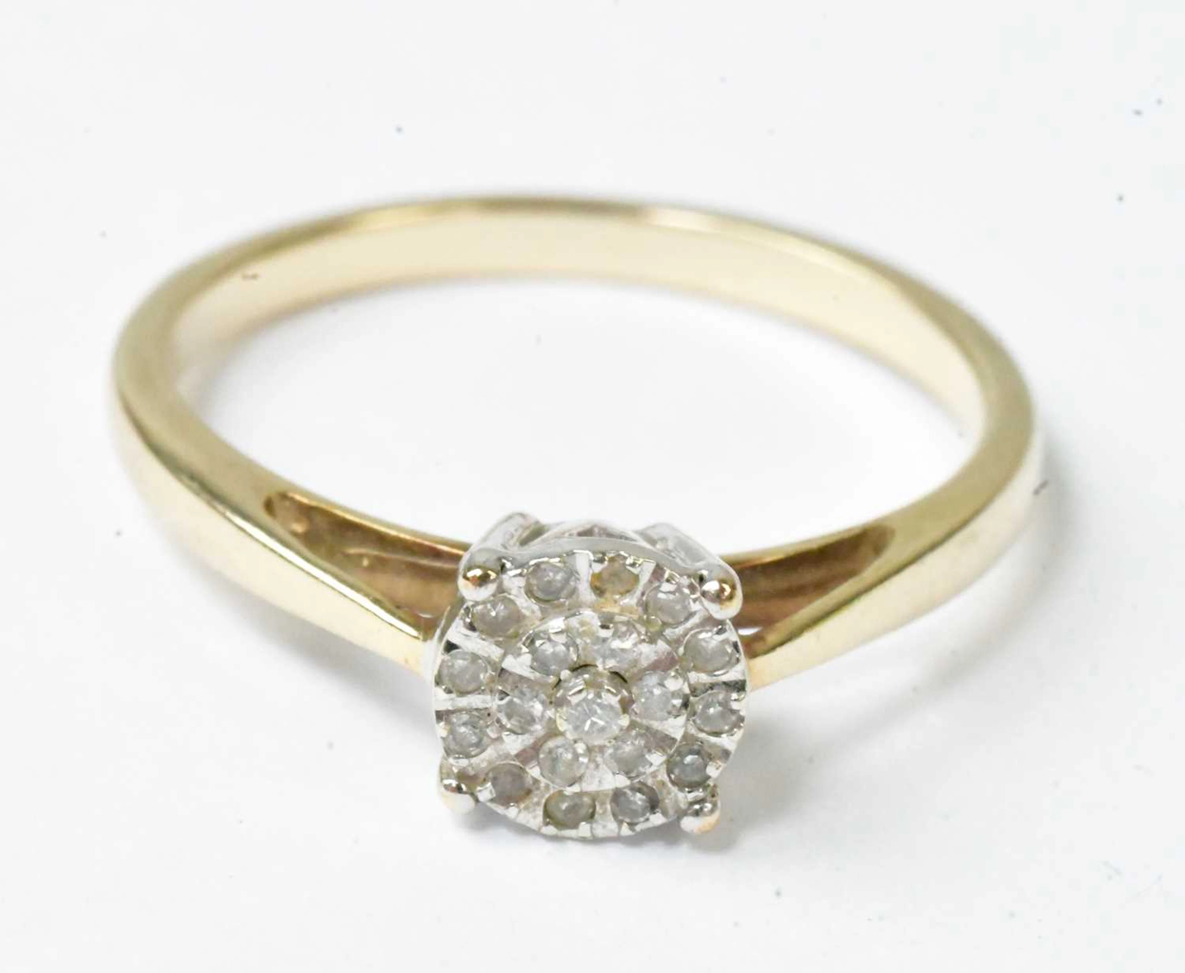 A 9ct yellow gold circular cluster ring set with tiny...