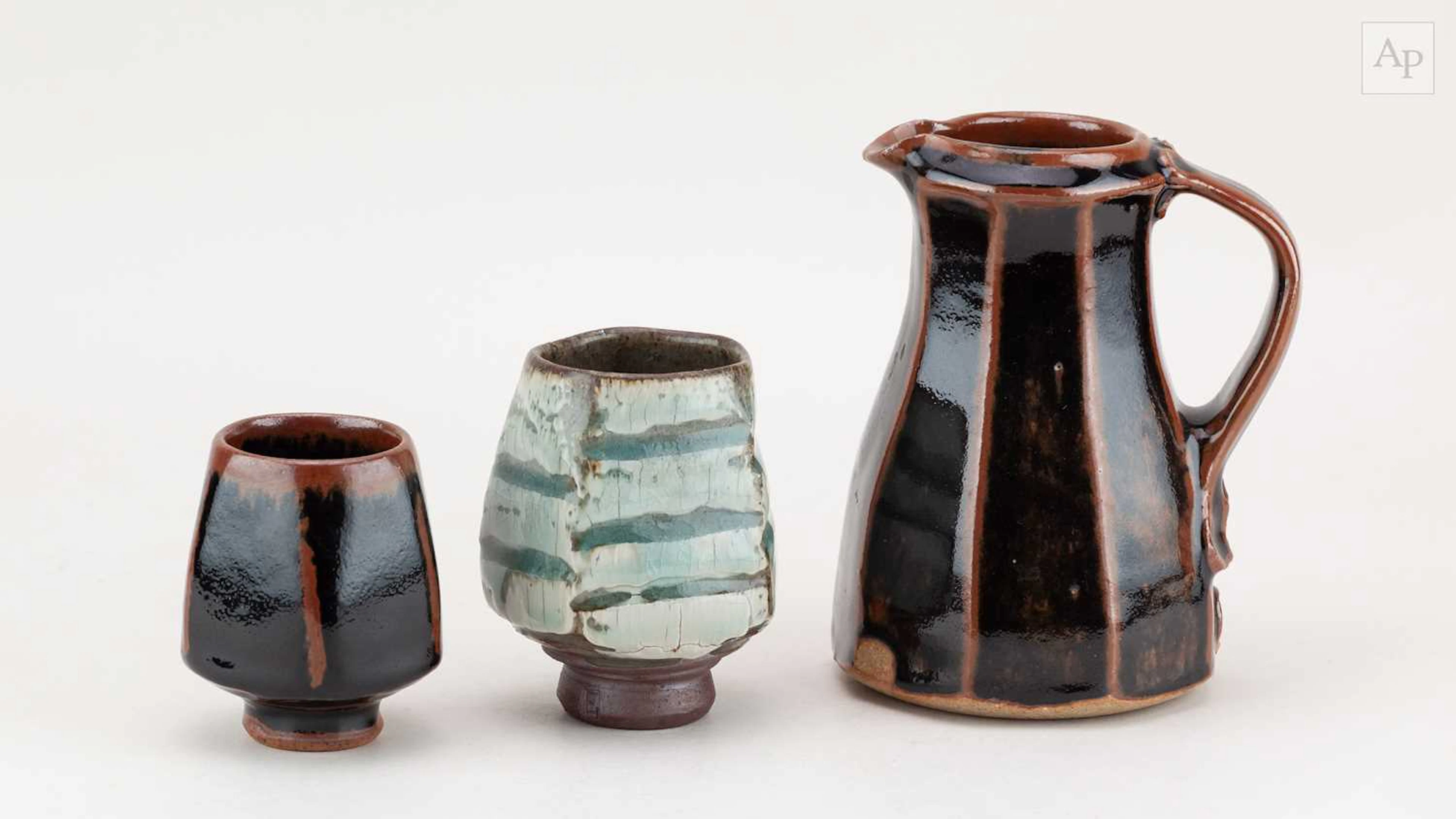 JAMES HAKE (born 1979); a faceted stoneware jug covered...