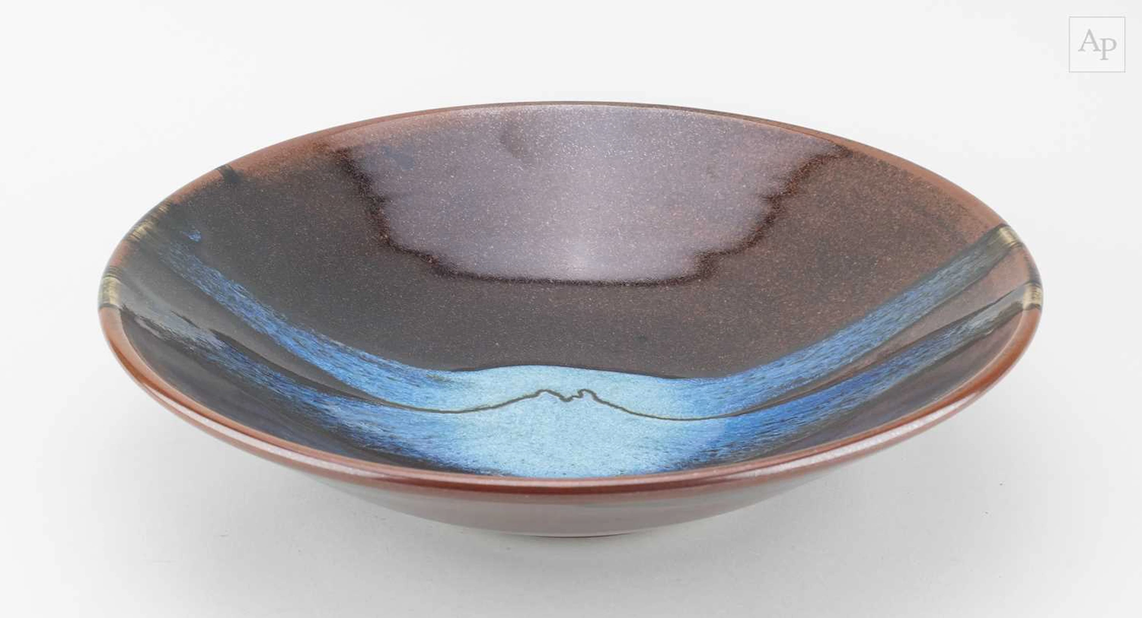 JAMES HAKE (born 1979); a shallow stoneware bowl covered...