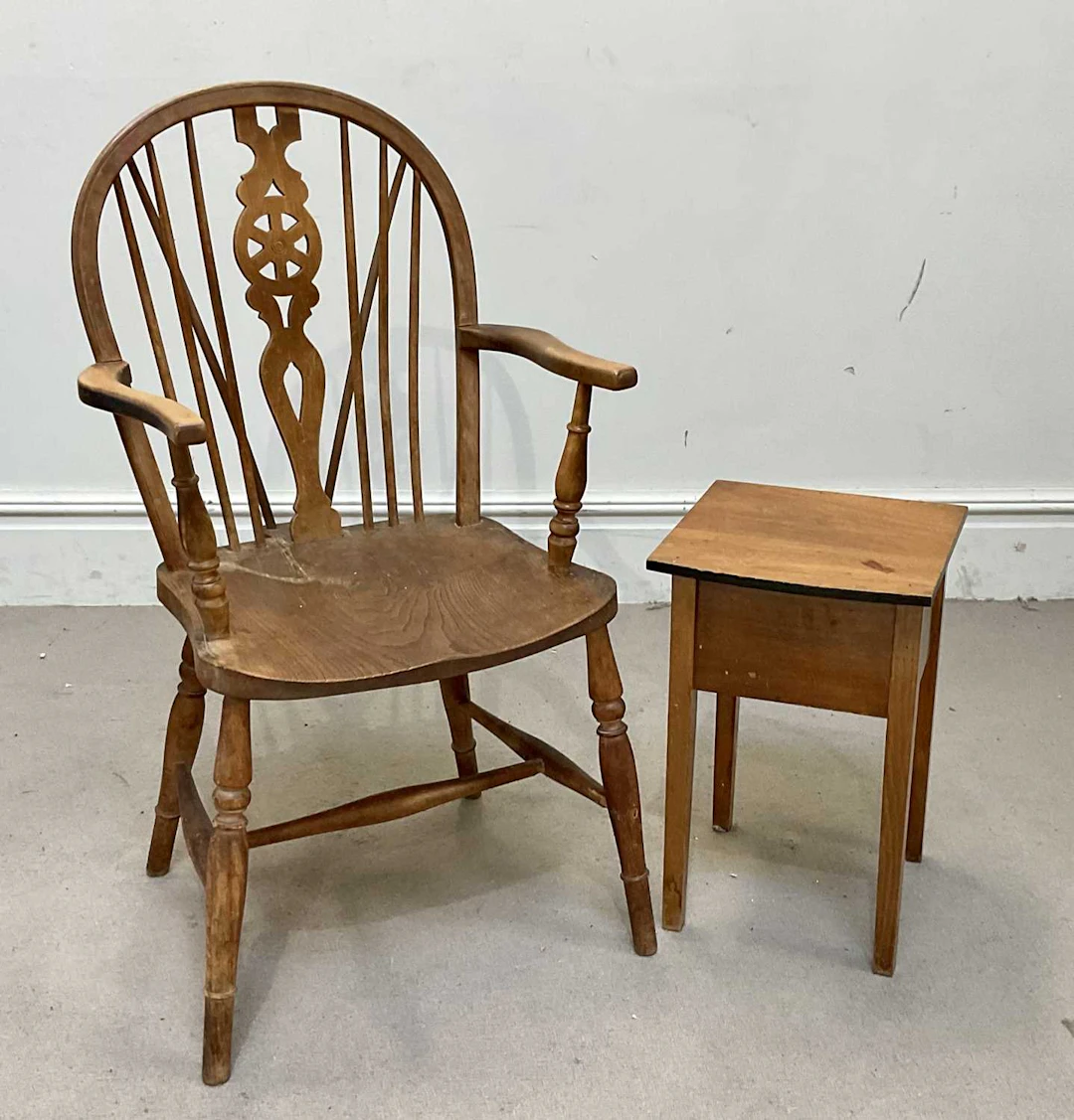 A beech and ash wheel back Windsor chair