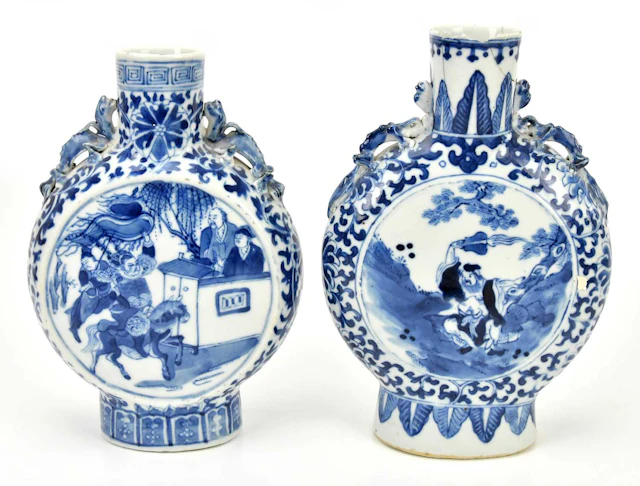 A near pair of late 19th century Chinese blue and white porcelain moon flasks