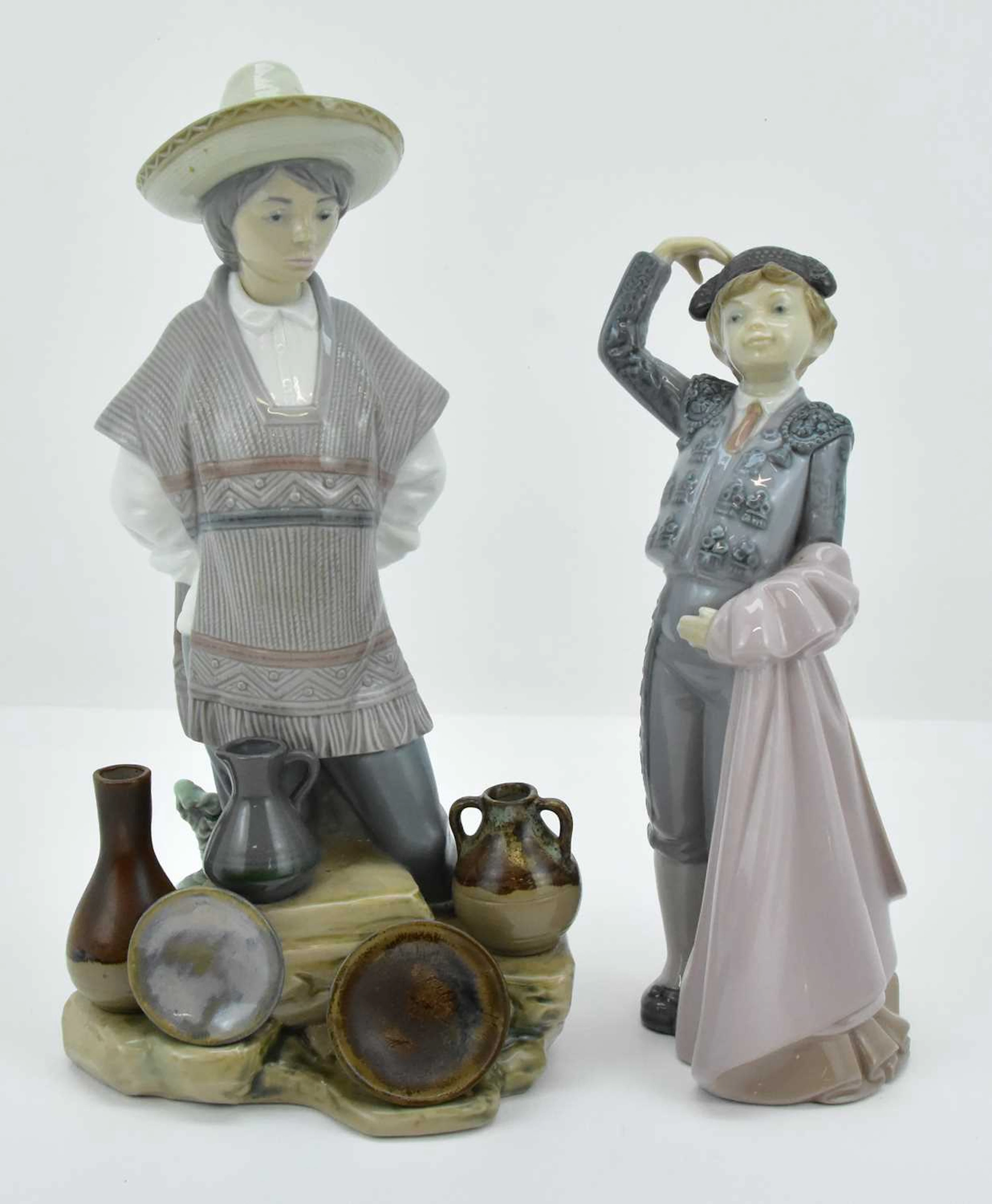 LLADRÓ; two high gloss porcelain boy figures