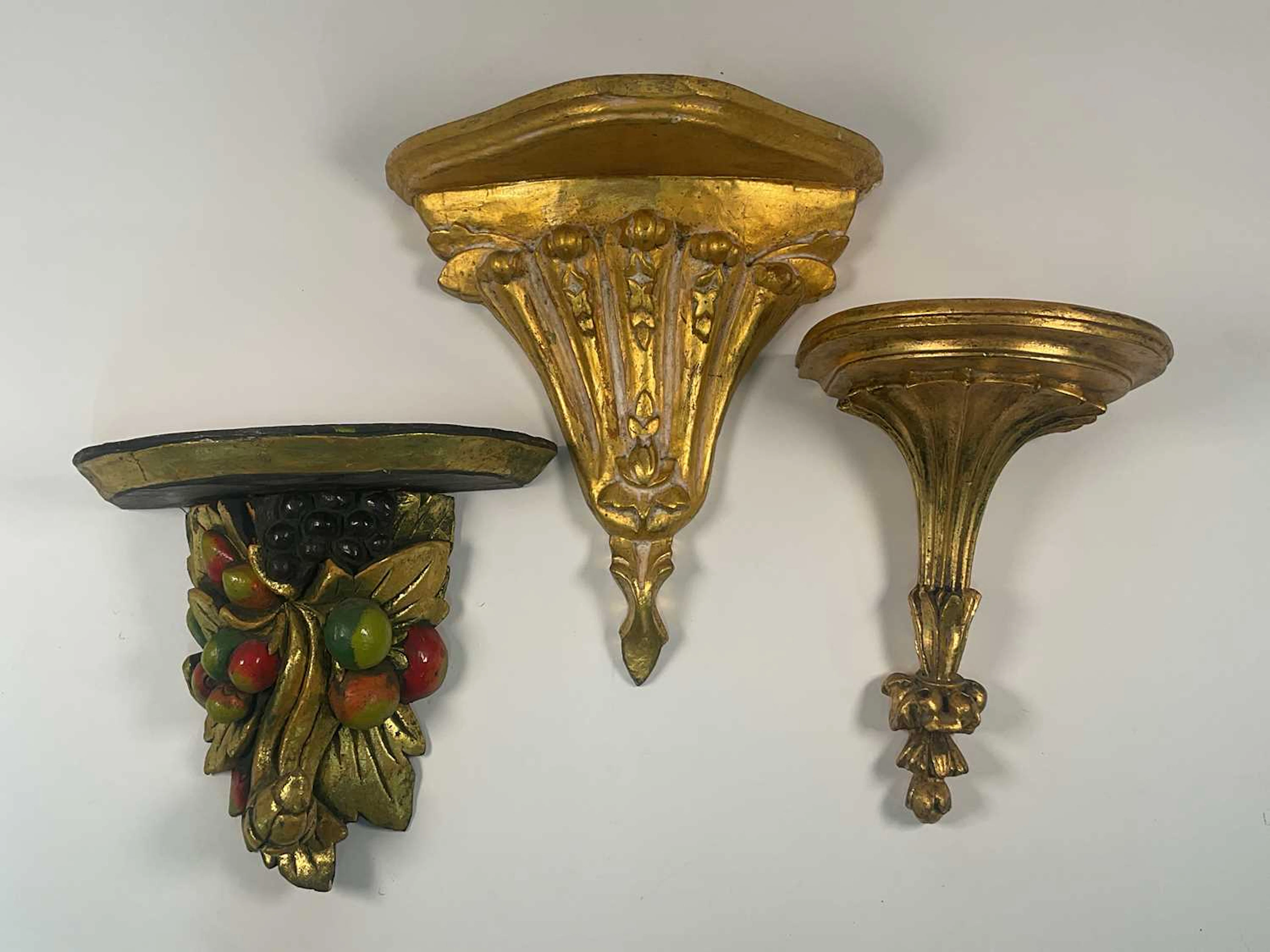 Two neoclassical gold gilded wall brackets