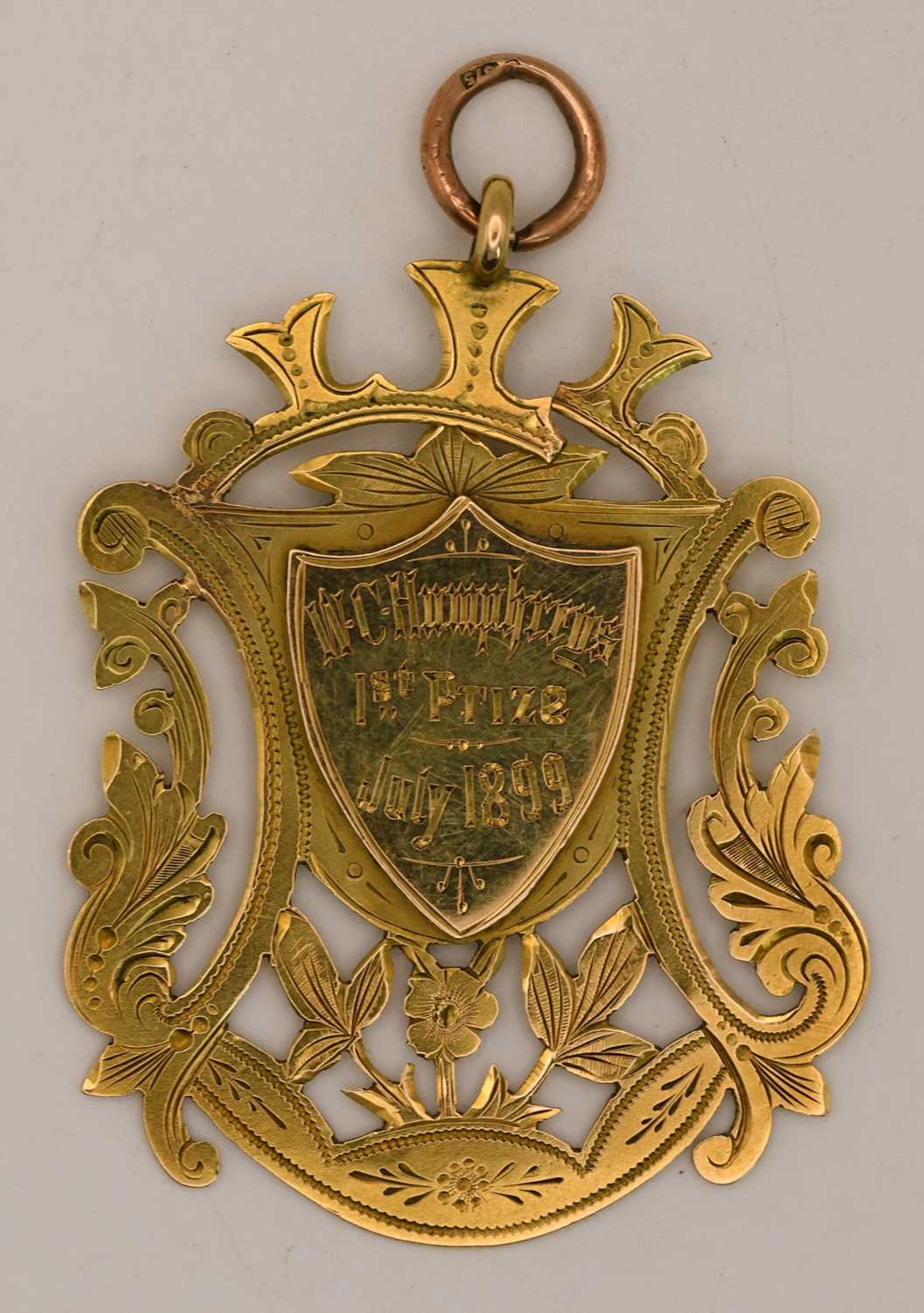 A 15ct yellow gold 1st prize fob medal