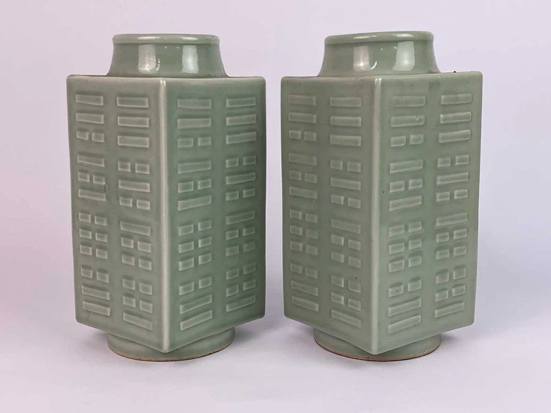 A pair of Chinese celadon glazed cong vases with molded...