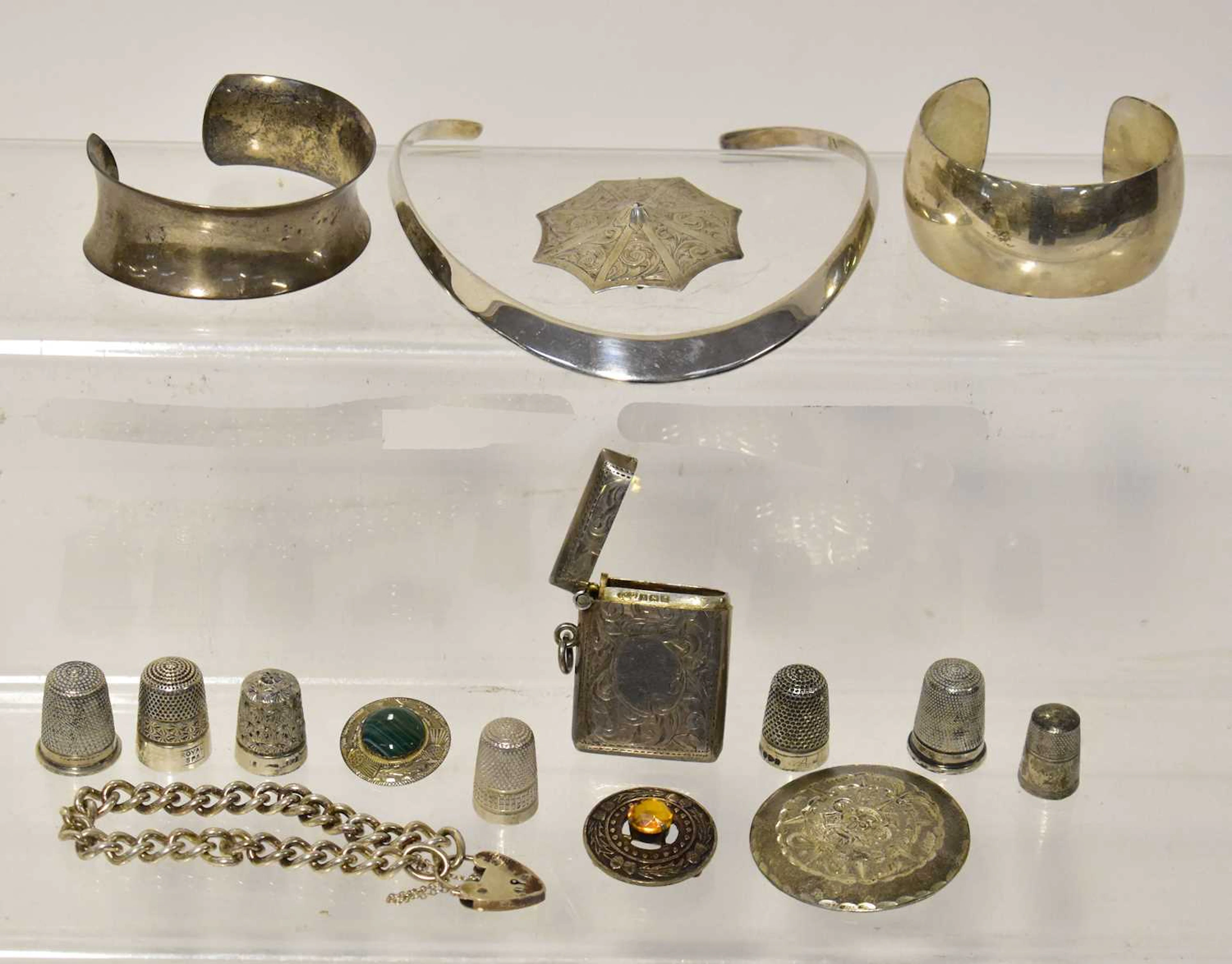 A group of silver jewellery and other items