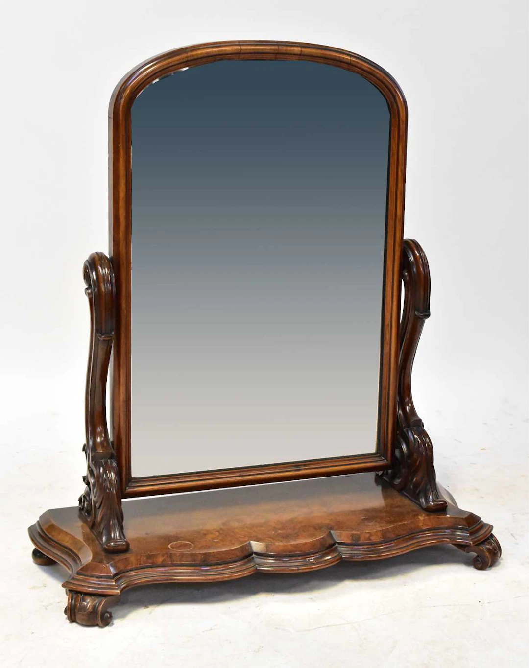 A Victorian walnut toilet/dressing table mirror