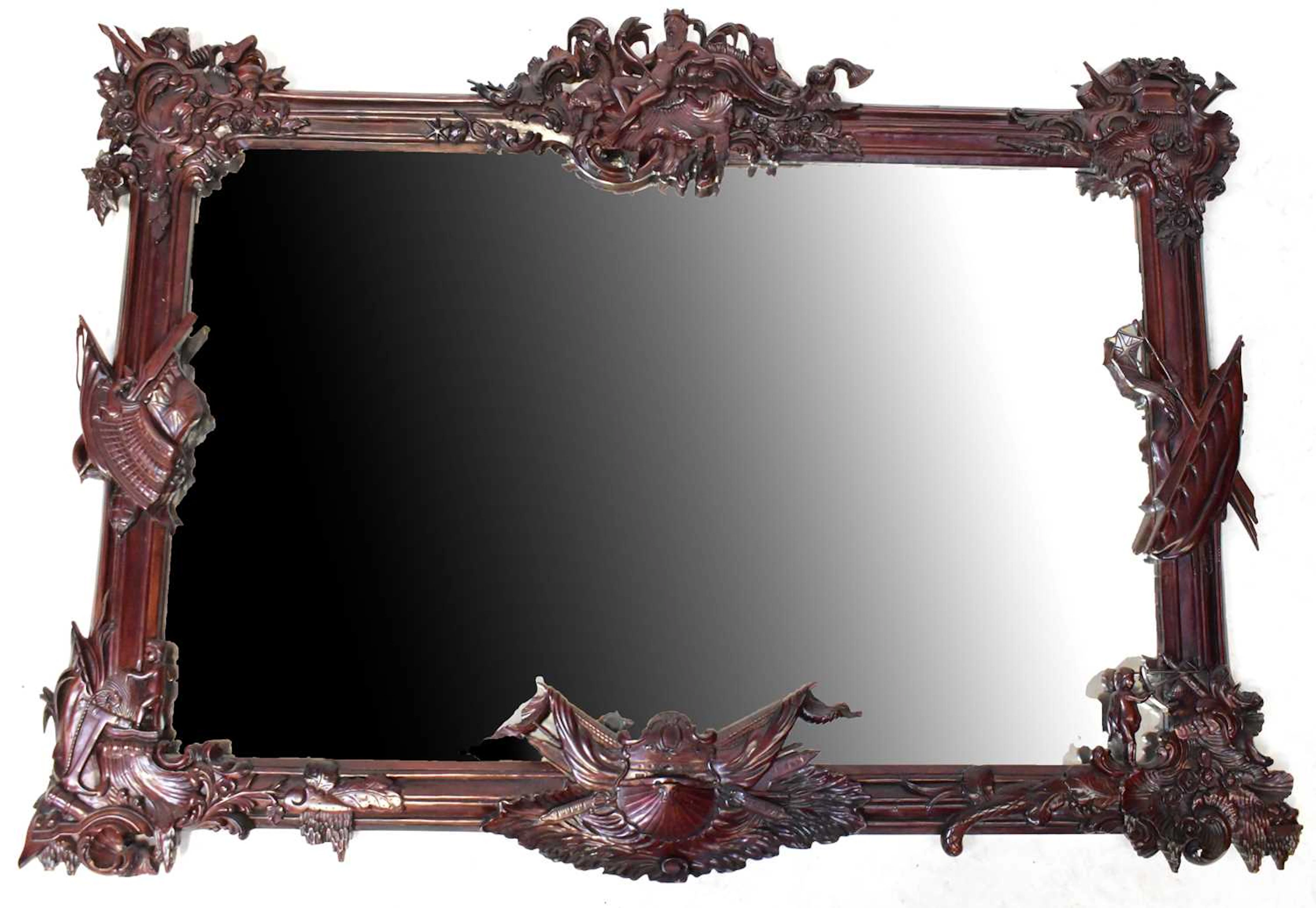 A 20th century maritime-themed overmantel mirror with carved mahogany frame