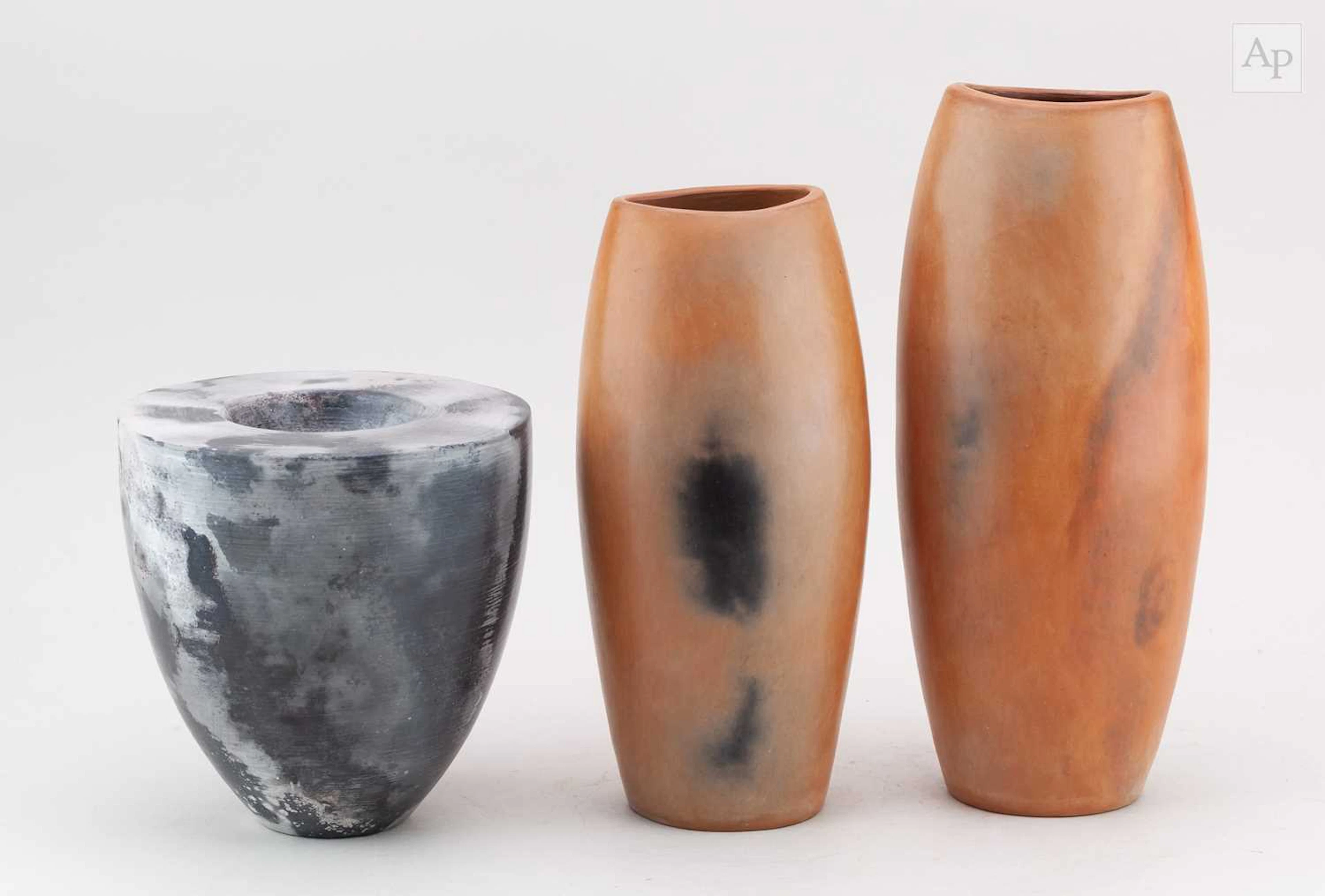 JOY SISLEY; two tall burnished earthenware vessels