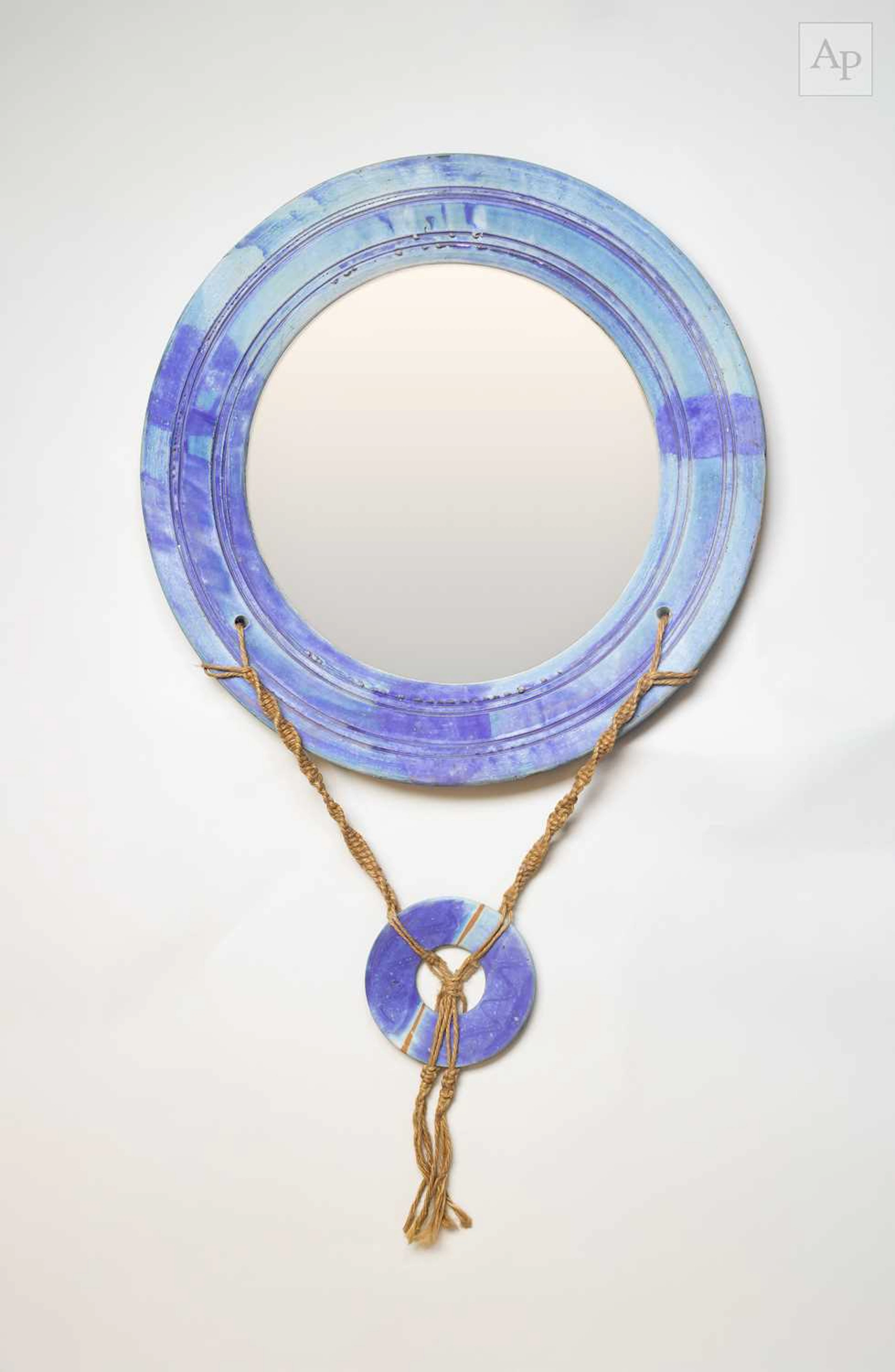SIMON SHAW (born 1961); a large stoneware mirror covered...