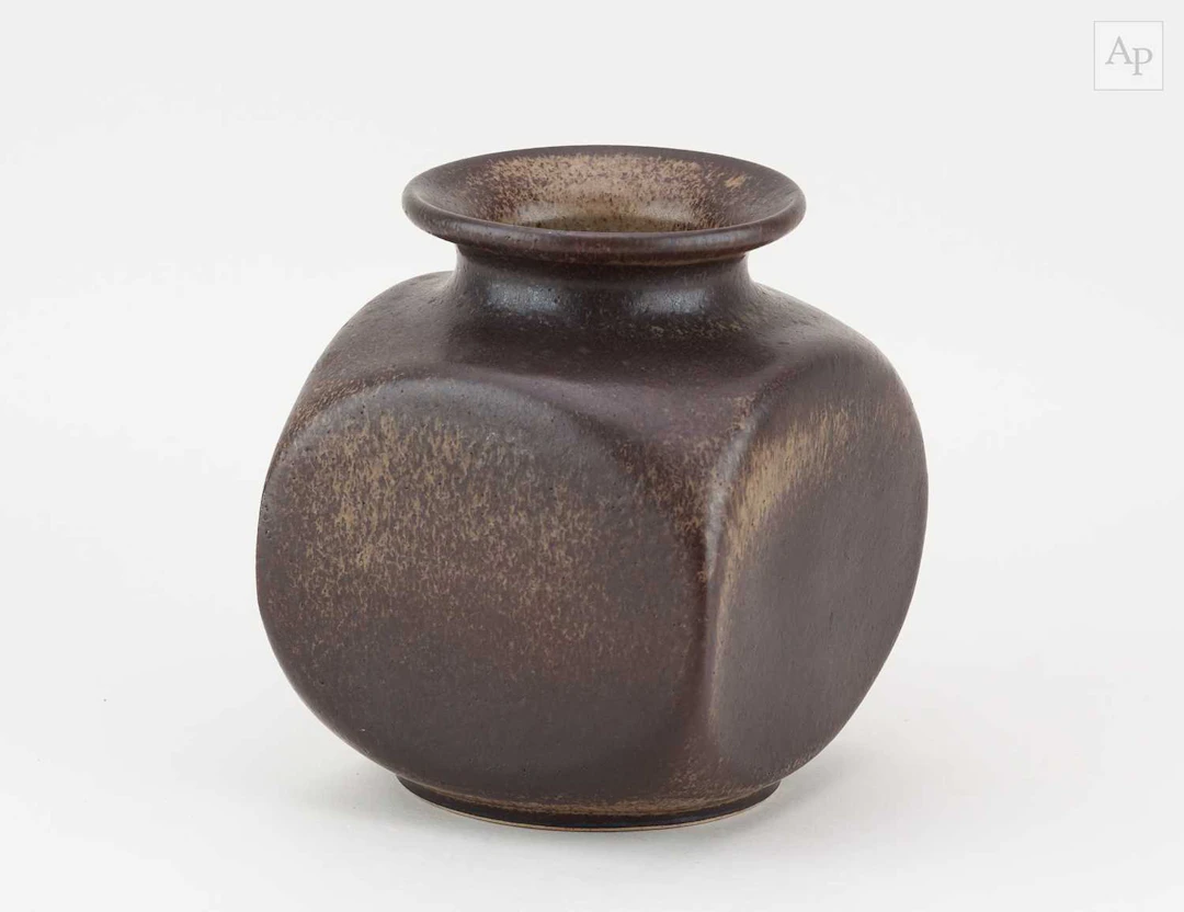 DEREK THORNTON; a squared off stoneware bottle covered in...