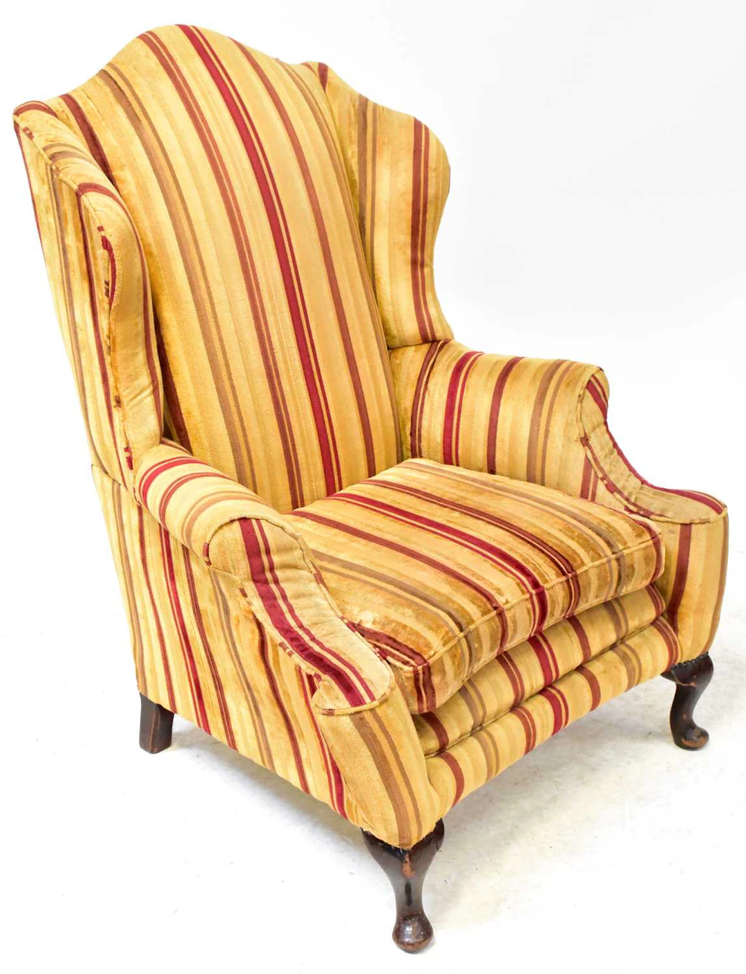 A 19th century wingback armchair