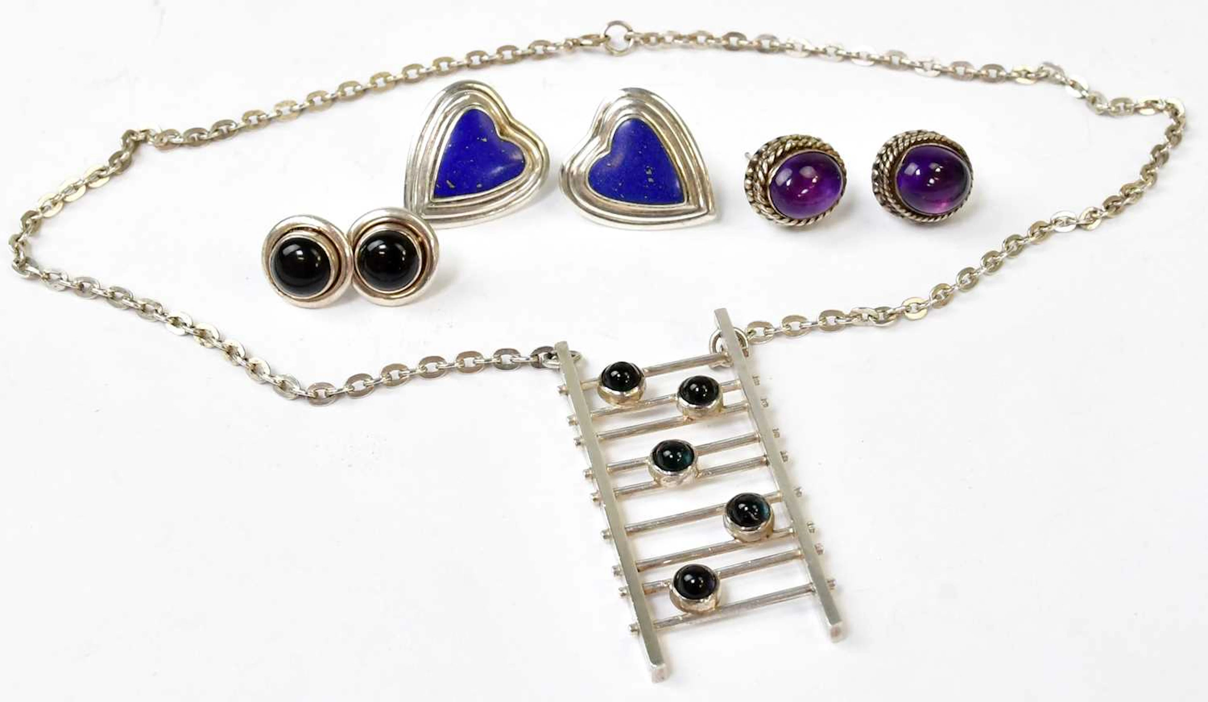 ANITA STOKES; a hallmarked silver pendant in the form of a ladder