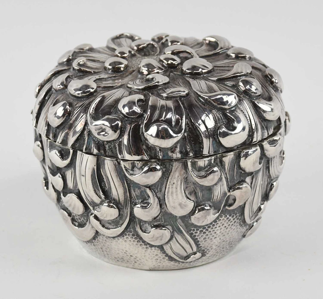 A Chinese Export silver circular lidded pot