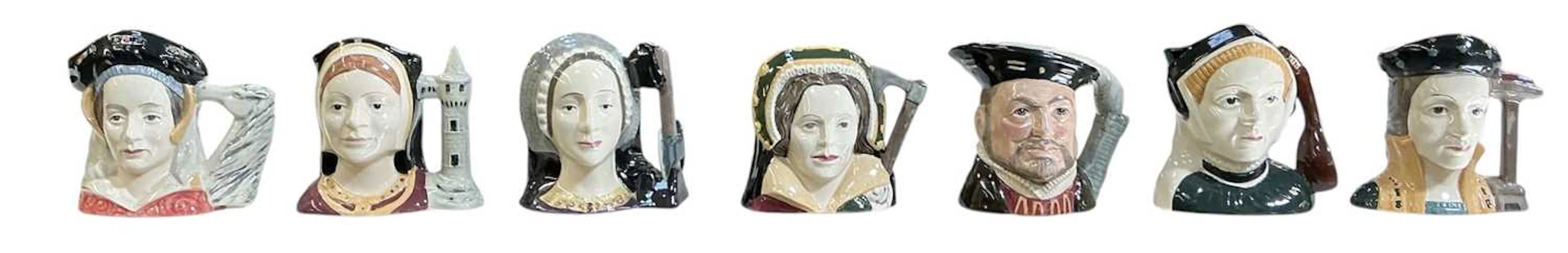 ROYAL DOULTON; a set of seven small character jugs