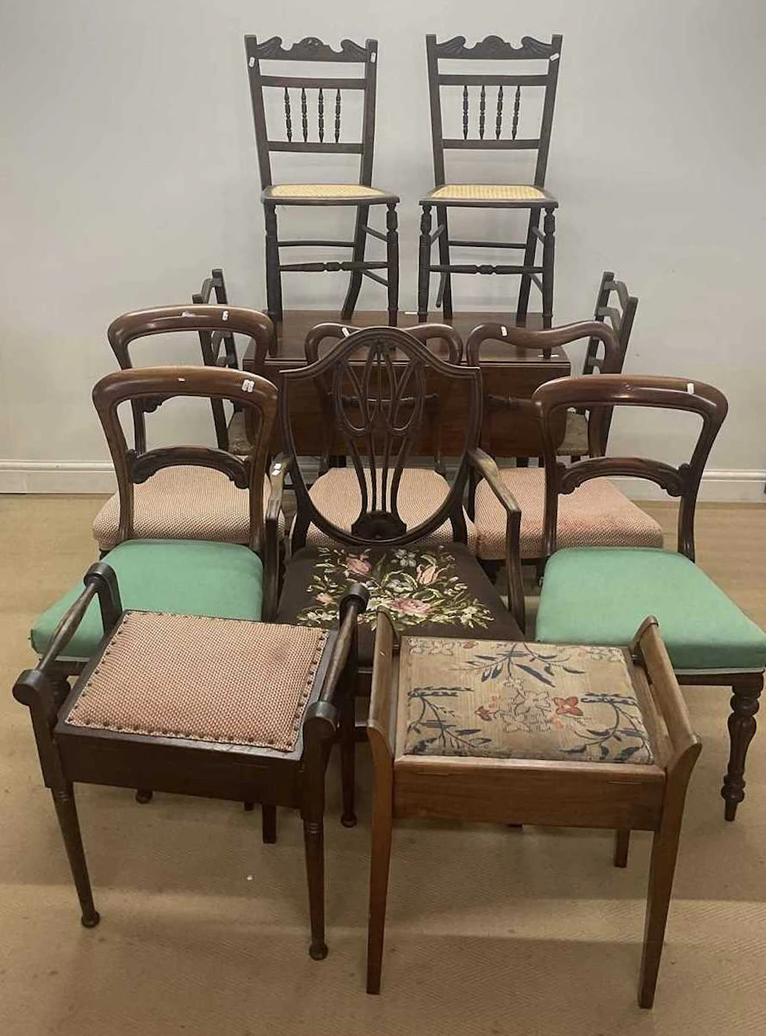 Five various mahogany dining chairs and an armchair
