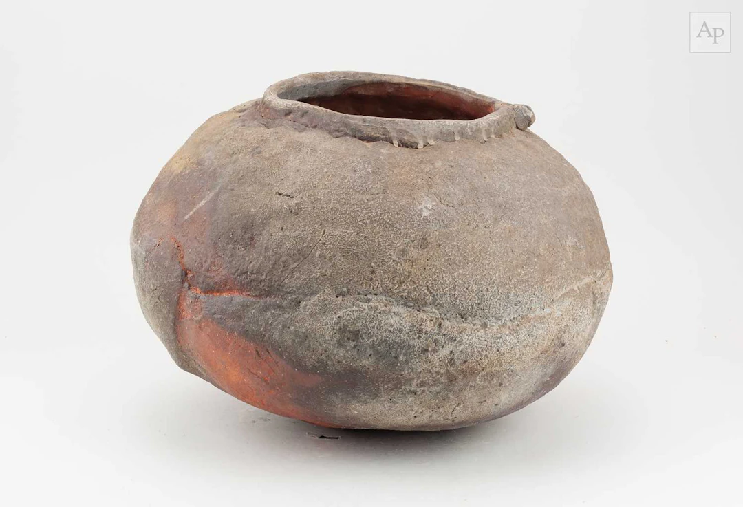 CHARLES BOUND (born 1939); a squat wood fired stoneware jar covered in ash glaze