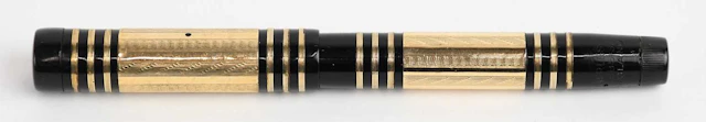 SWAN/MABIE TODD; a 1930s black bakelite plastic gold...