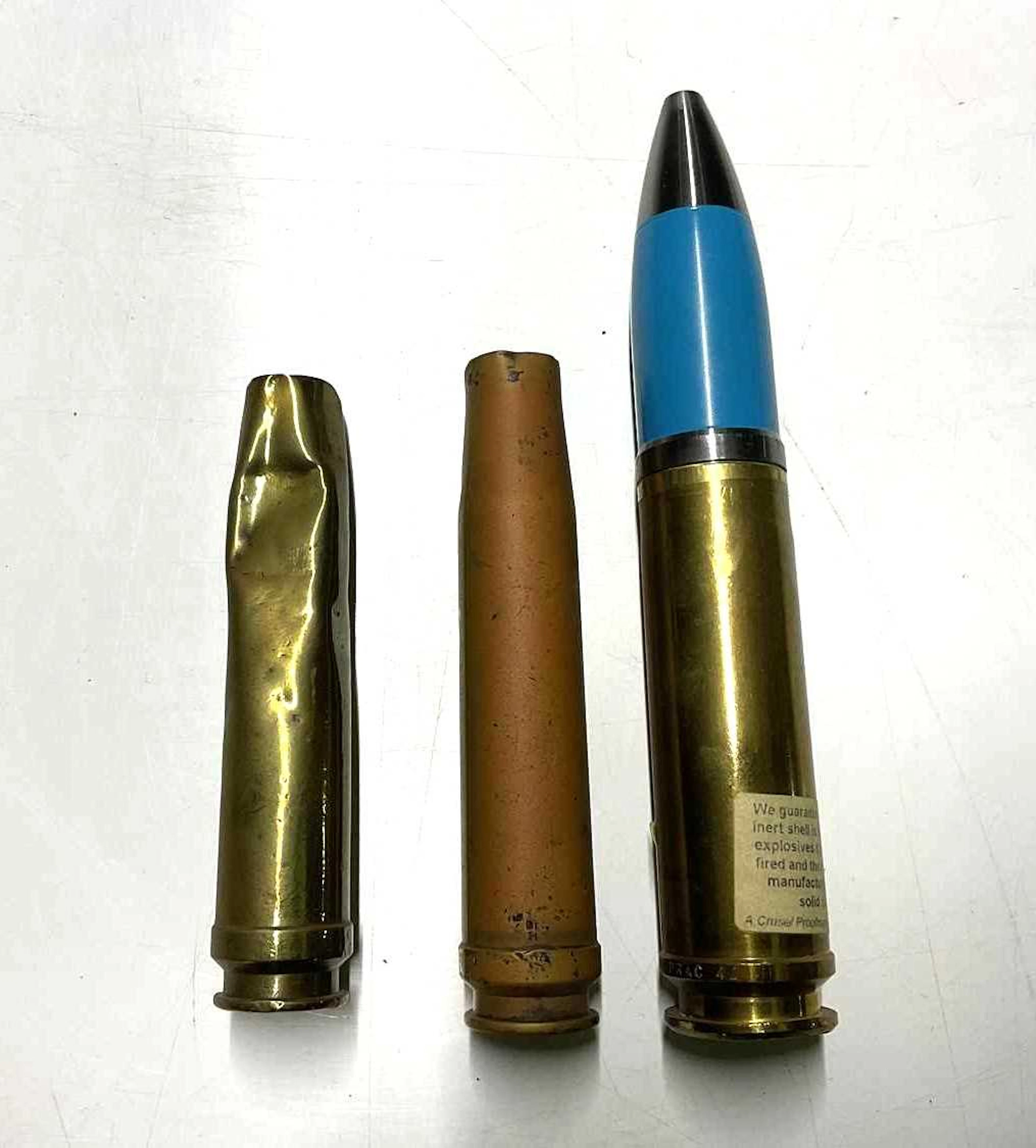 Three brass shell cases