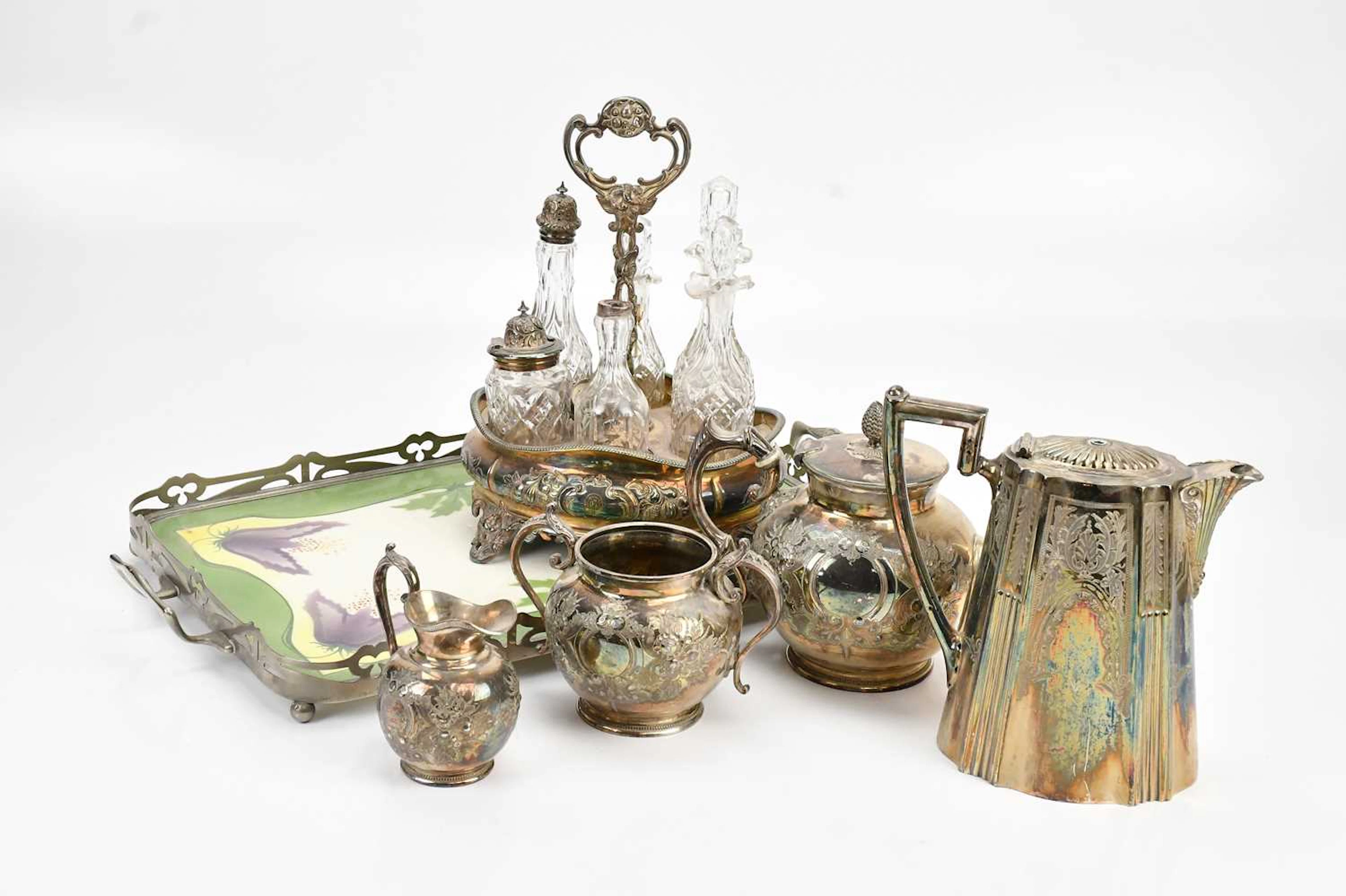 A Victorian silver plated bottle stand