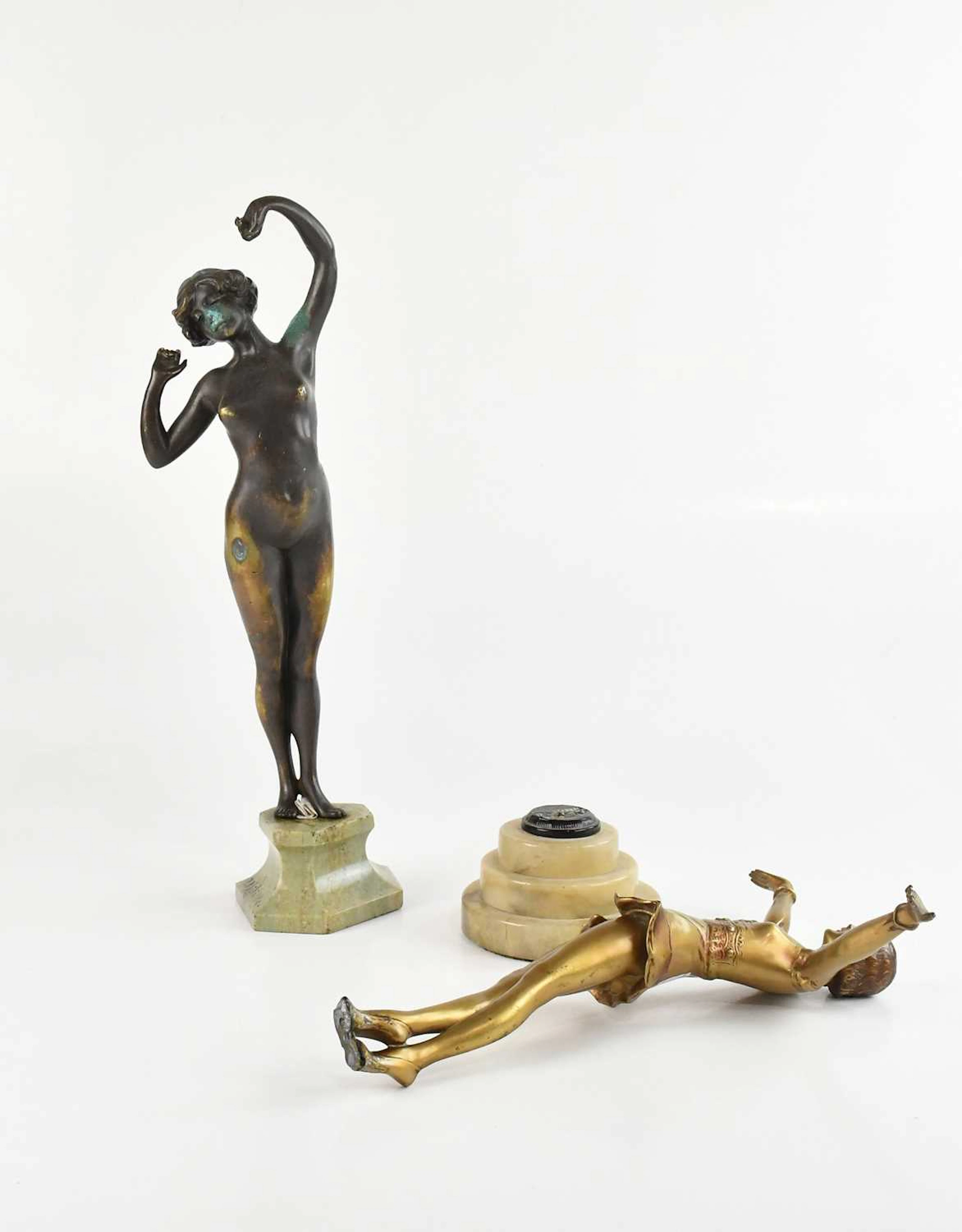 AFTER PAUL PHILIPPE; an Art Deco painted bronze figure of nude female stretching