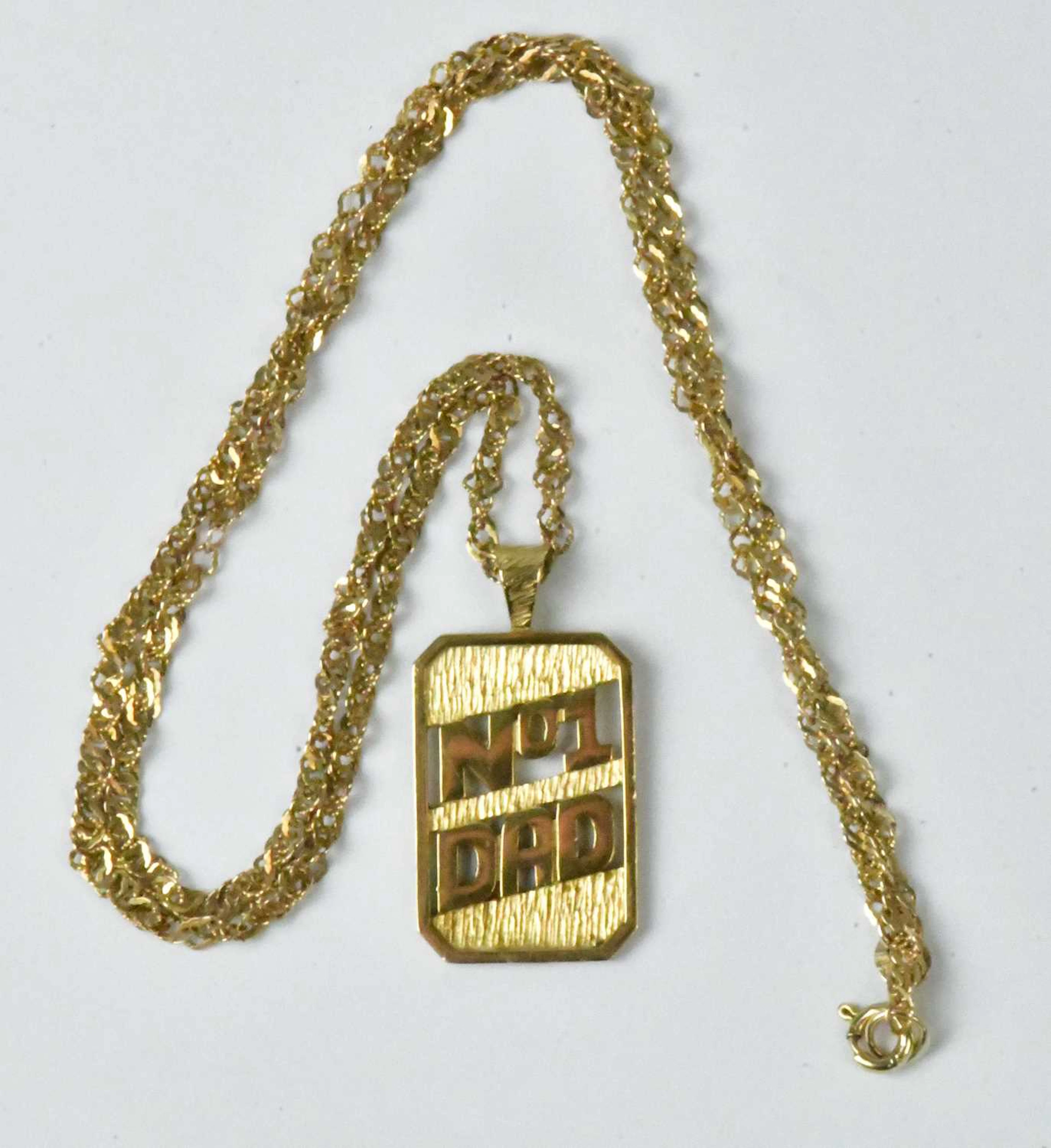 A 9ct yellow gold bark-effect pierced pendant inscribed 'No