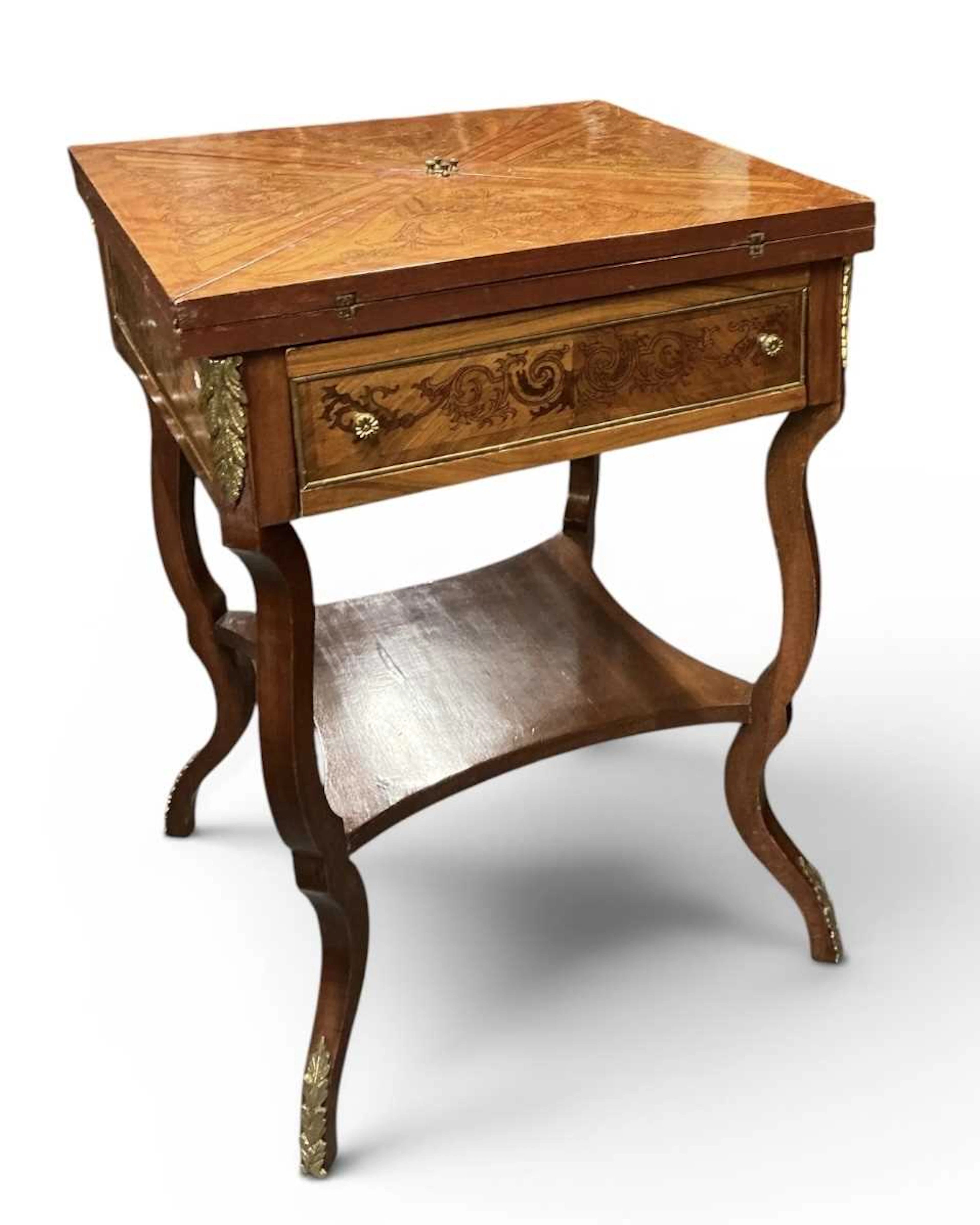 A reproduction French Empire style kingwood and gilt...