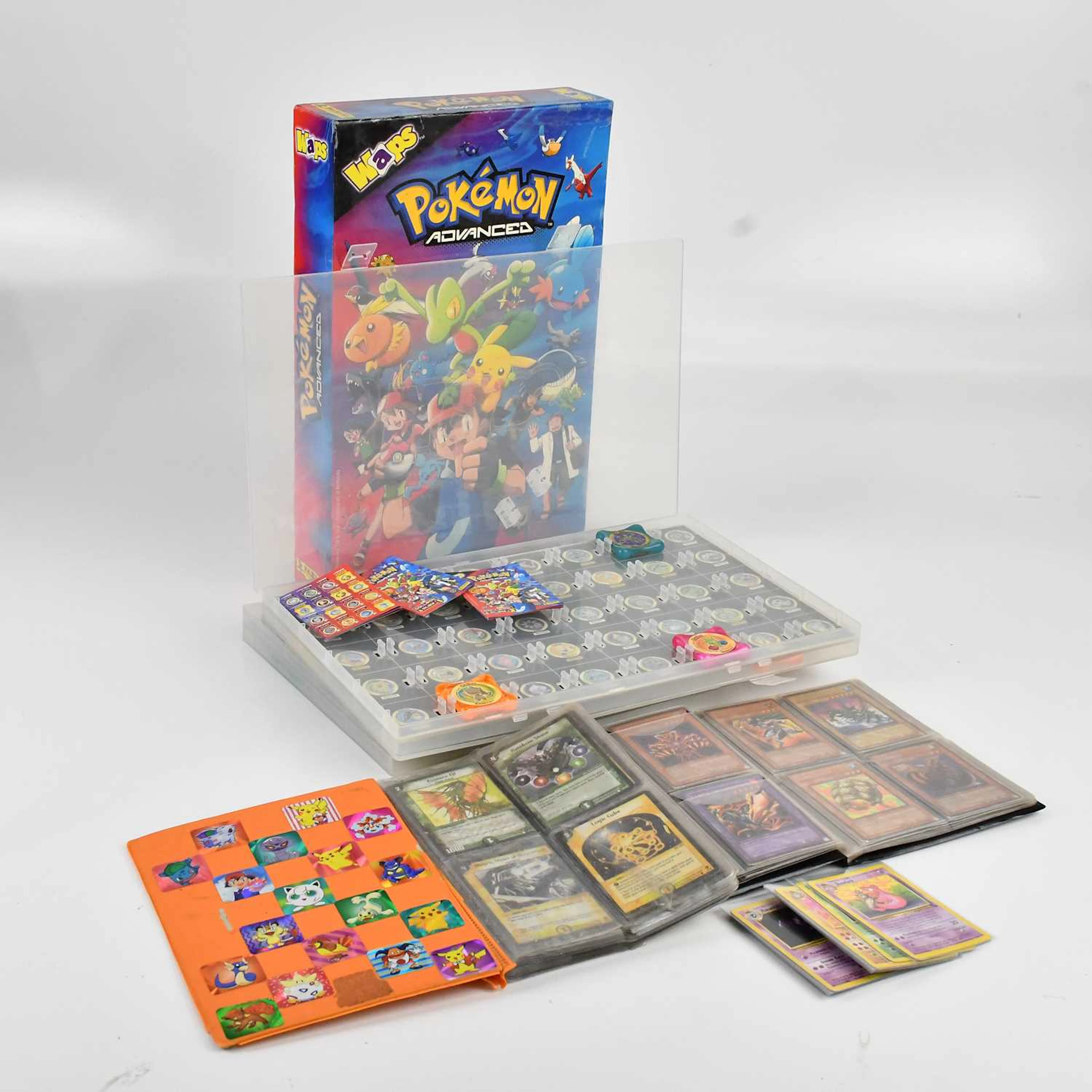 A collection of trading cards including Pokemon sets comprising base set