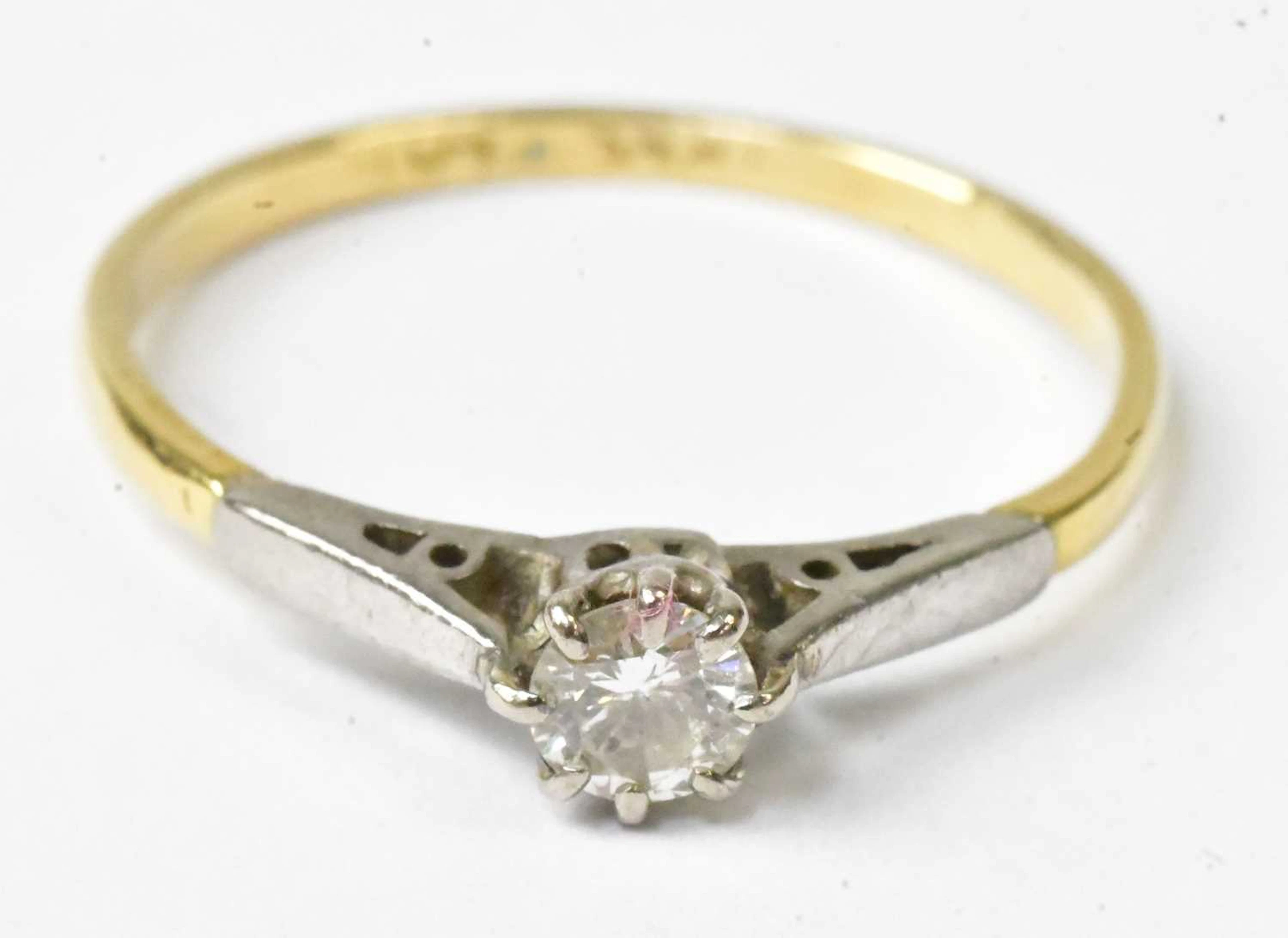 A yellow metal and platinum diamond solitaire ring