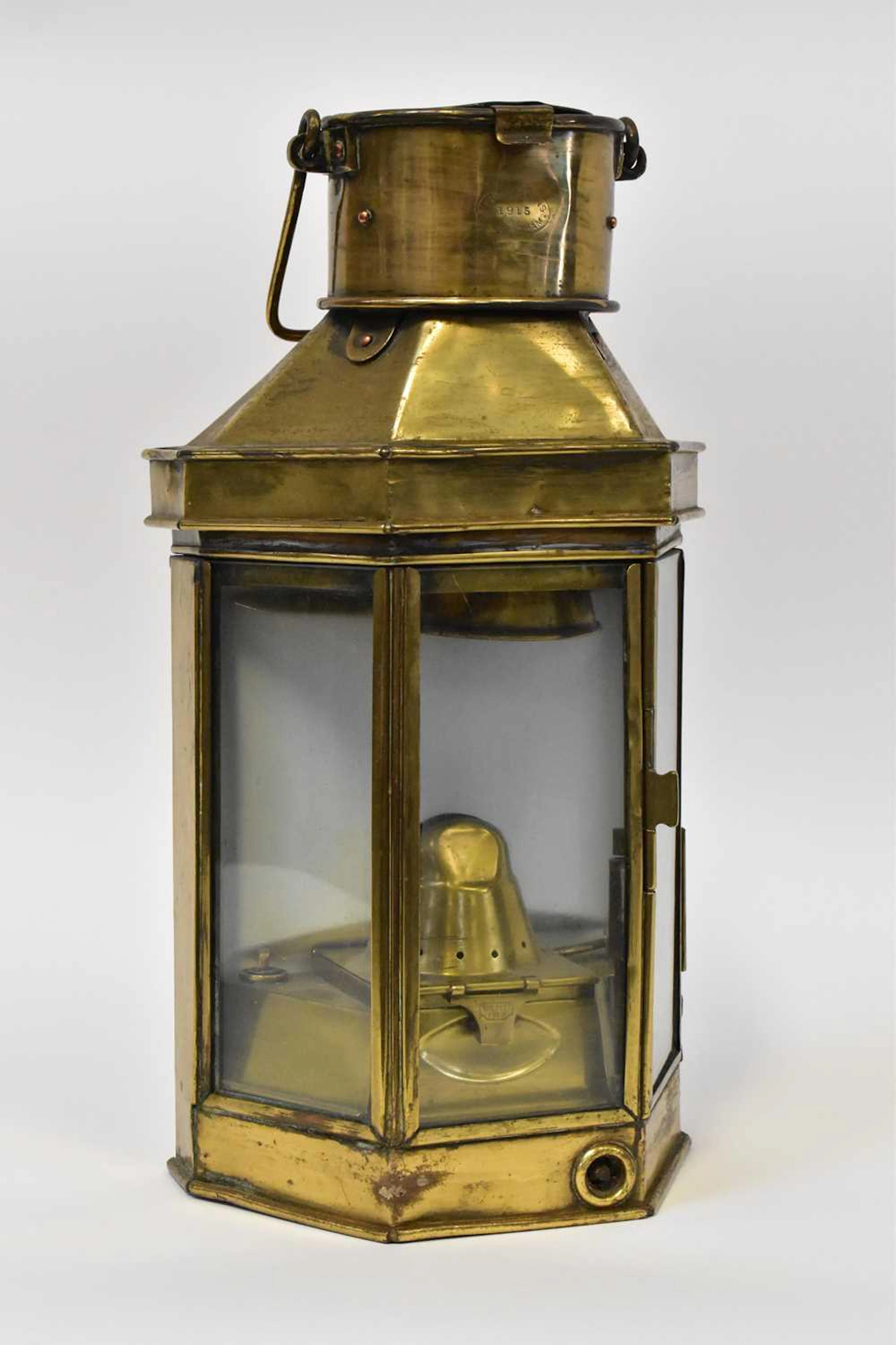 A brass ship's bulkhead lamp