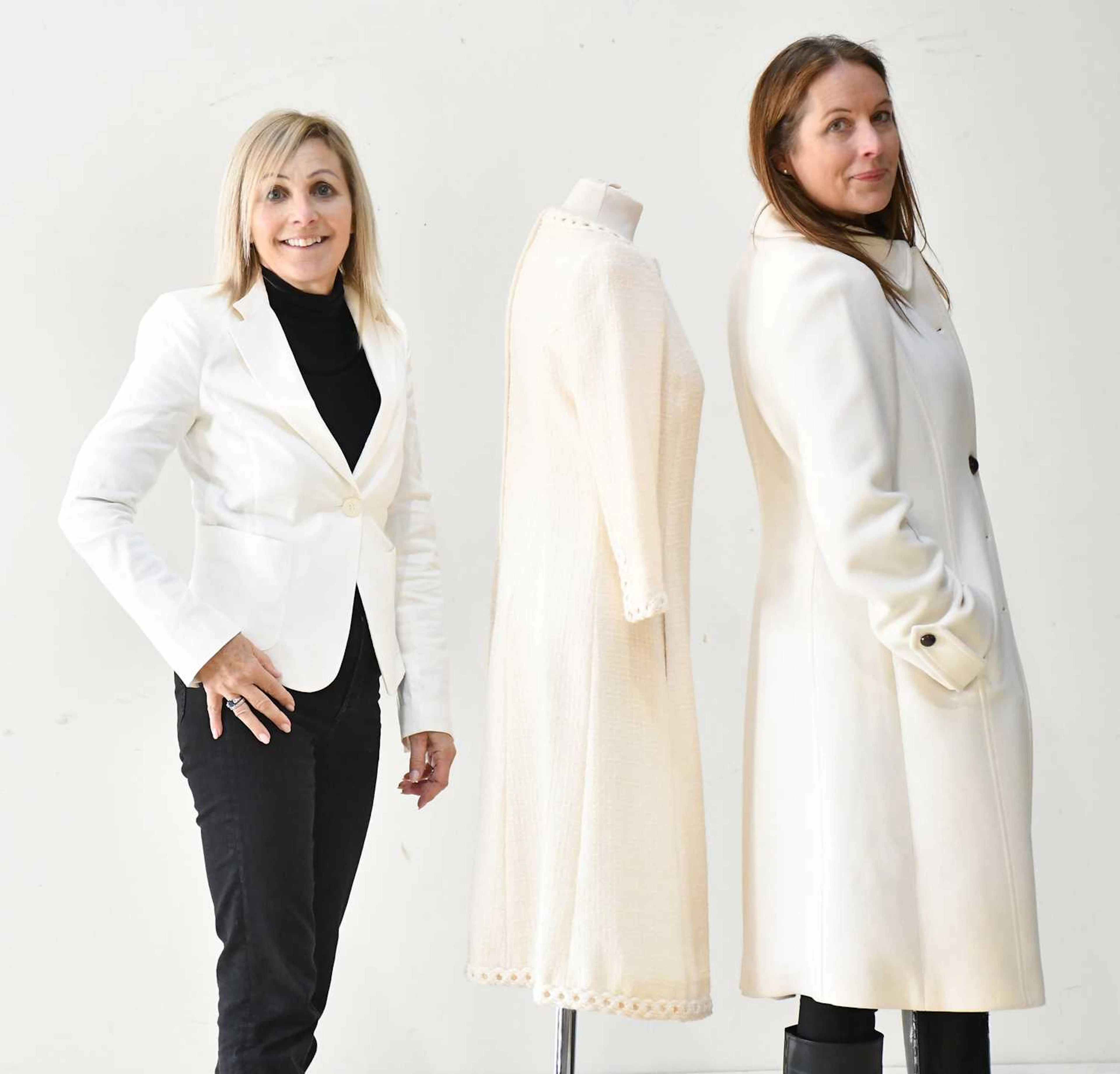 ARMANI COLLEZIONI; a cream 100% wool knee length coat with round collar