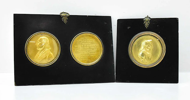 An early 19th century paired gilt metal commemorative...
