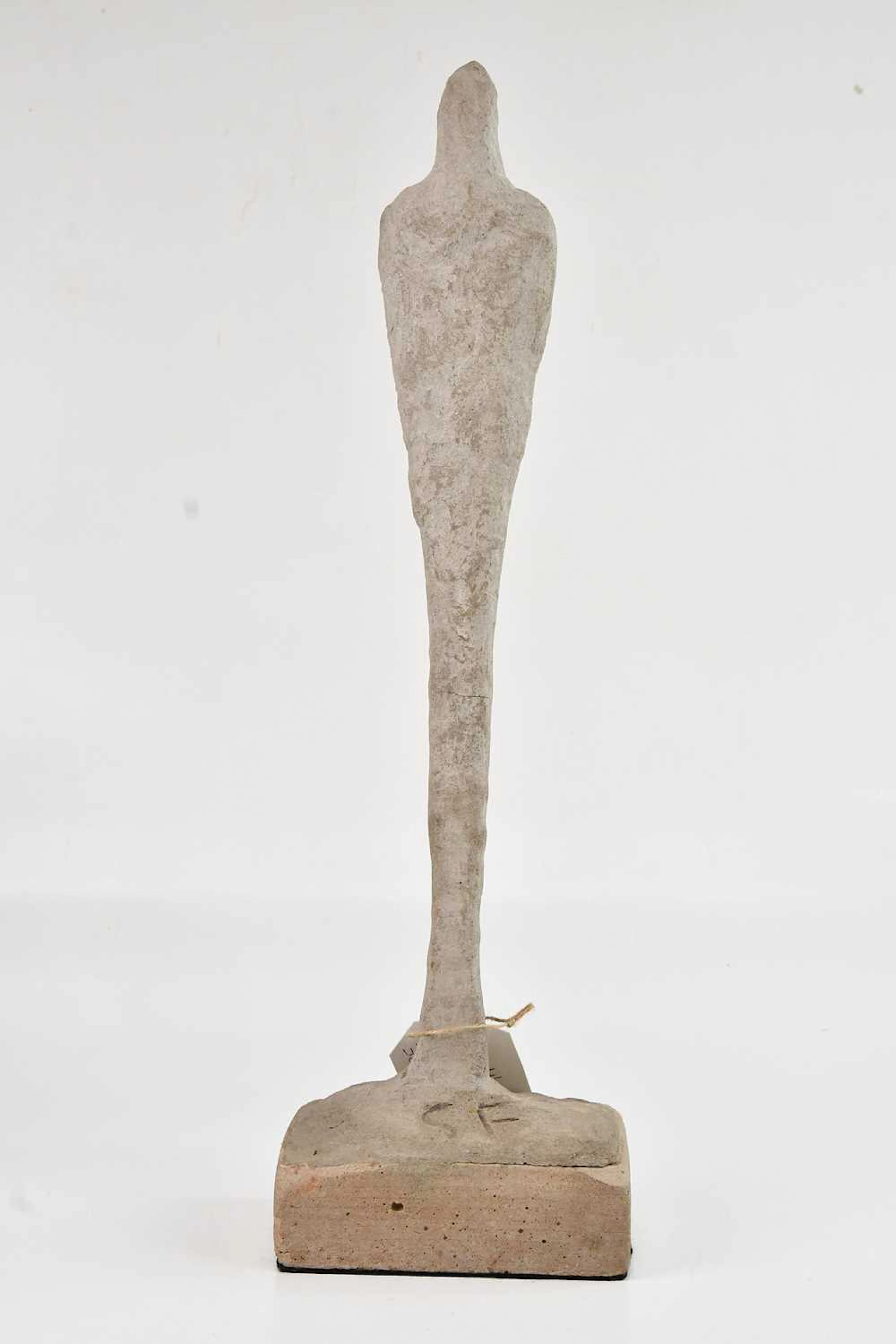 An Alberto Giacometti style concrete sculpture