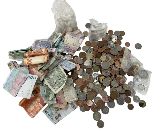 A quantity of assorted all world coins and banknotes