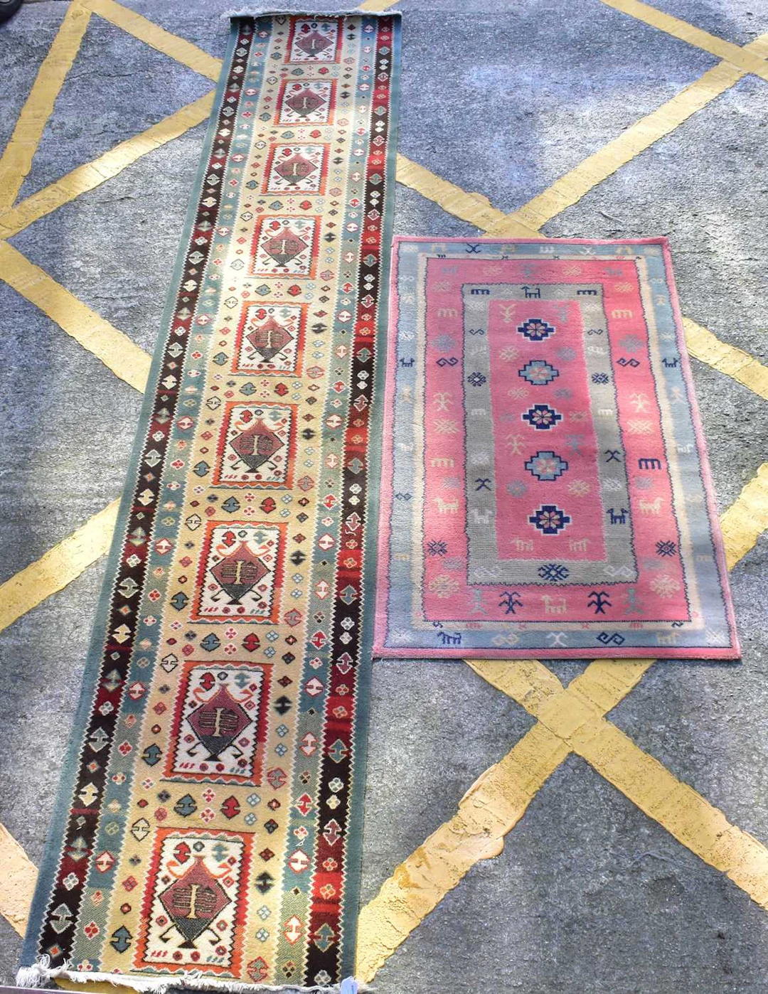 Four rugs comprising a woollen hall runner with nine...