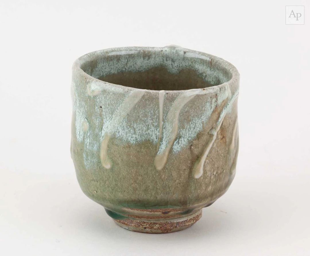 TAKESHI YASUDA (born 1943); a stoneware yunomi covered in...