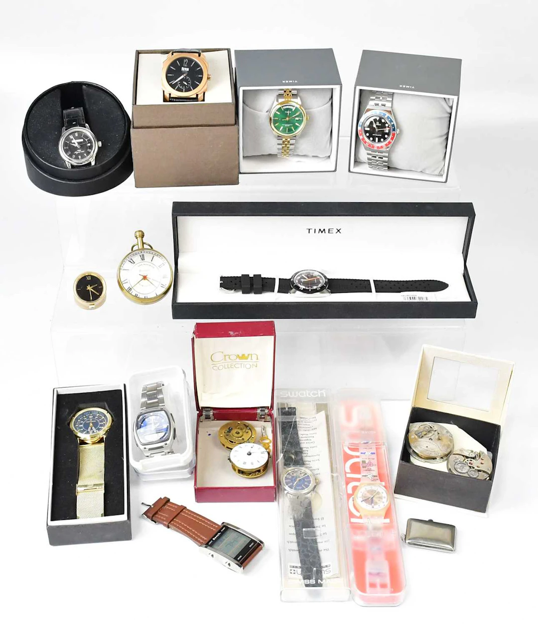 A collection of boxed fashion watches